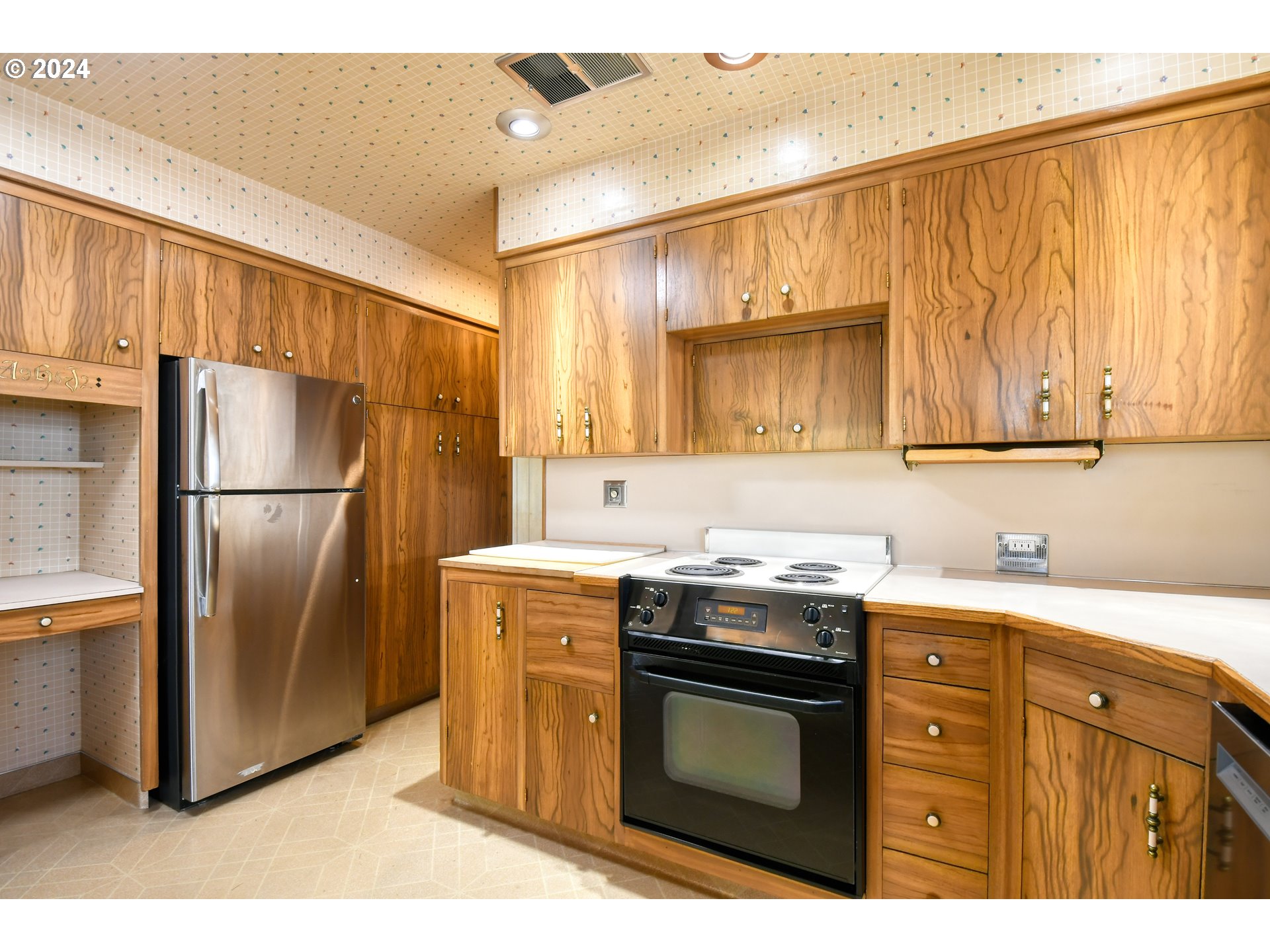 405 Northwest Johns Lane Pendleton, OR 97801 - Photo 17 of 48 a kitchen with stainless steel appliances granite countertop a stove a refrigerator and a sink