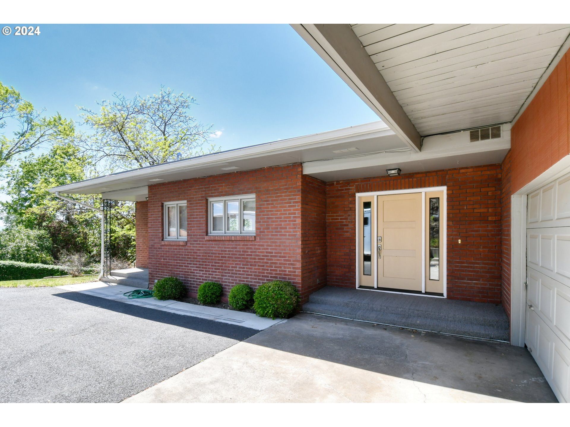 405 Northwest Johns Lane Pendleton, OR 97801 - Photo 3 of 48 a front view of a house with a yard
