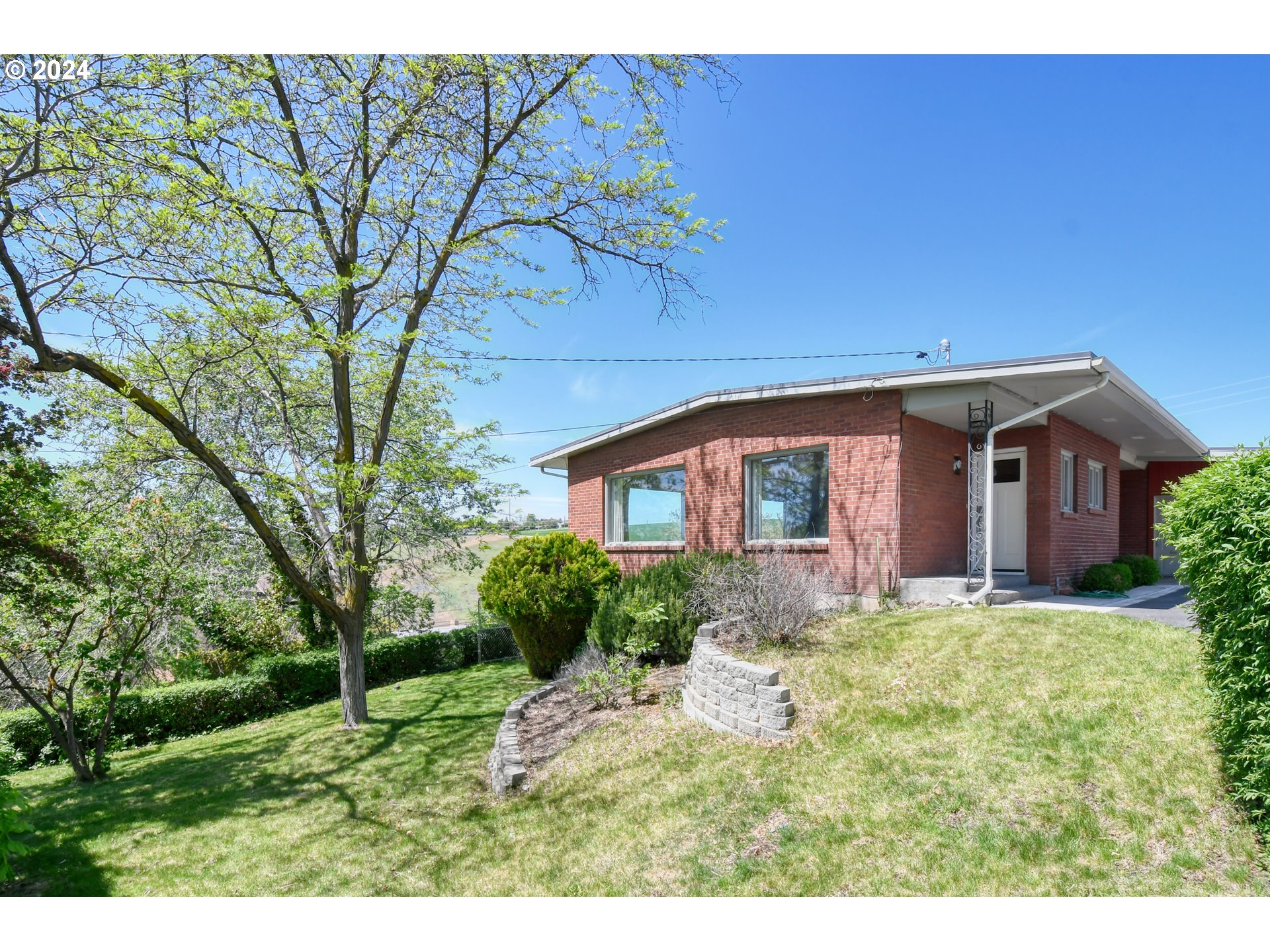 405 Northwest Johns Lane Pendleton, OR 97801 - Photo 37 of 48 a front view of a house with a yard