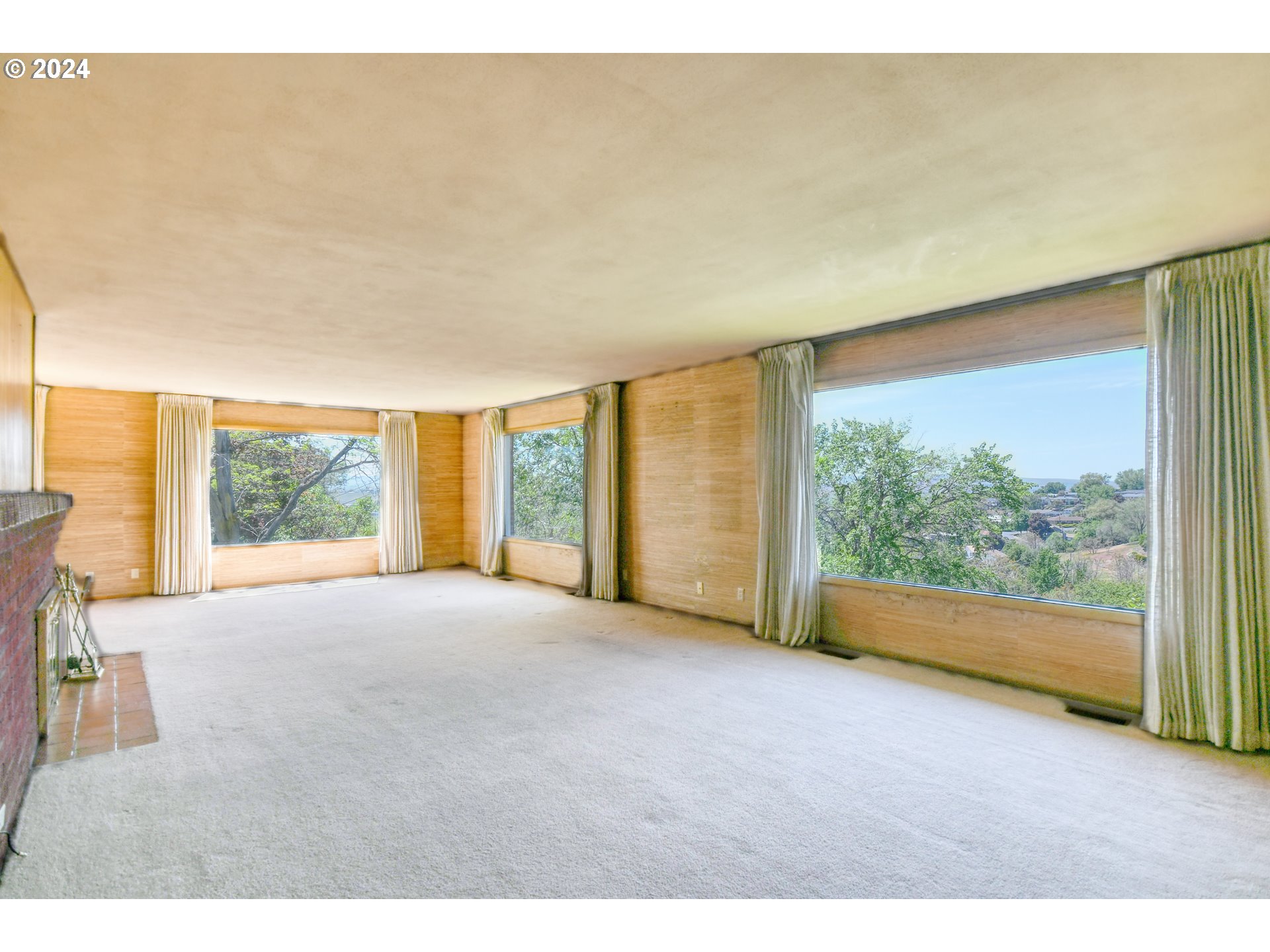 405 Northwest Johns Lane Pendleton, OR 97801 - Photo 7 of 48 a view of an empty room with windows and city view