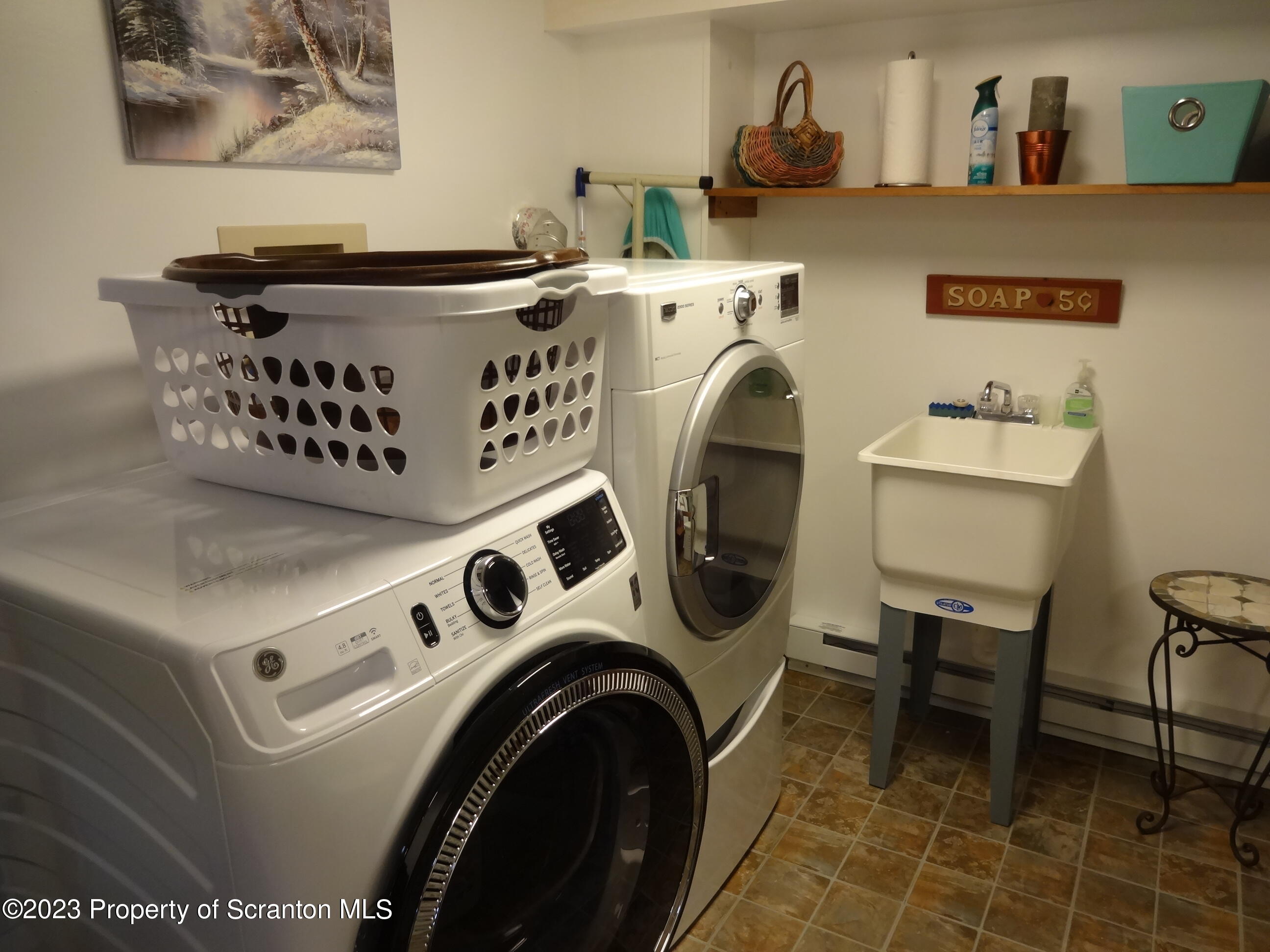 15 Buck River Road Thornhurst, PA 18424 - Photo 13 of 38 a utility room with dryer washer and a view of living room
