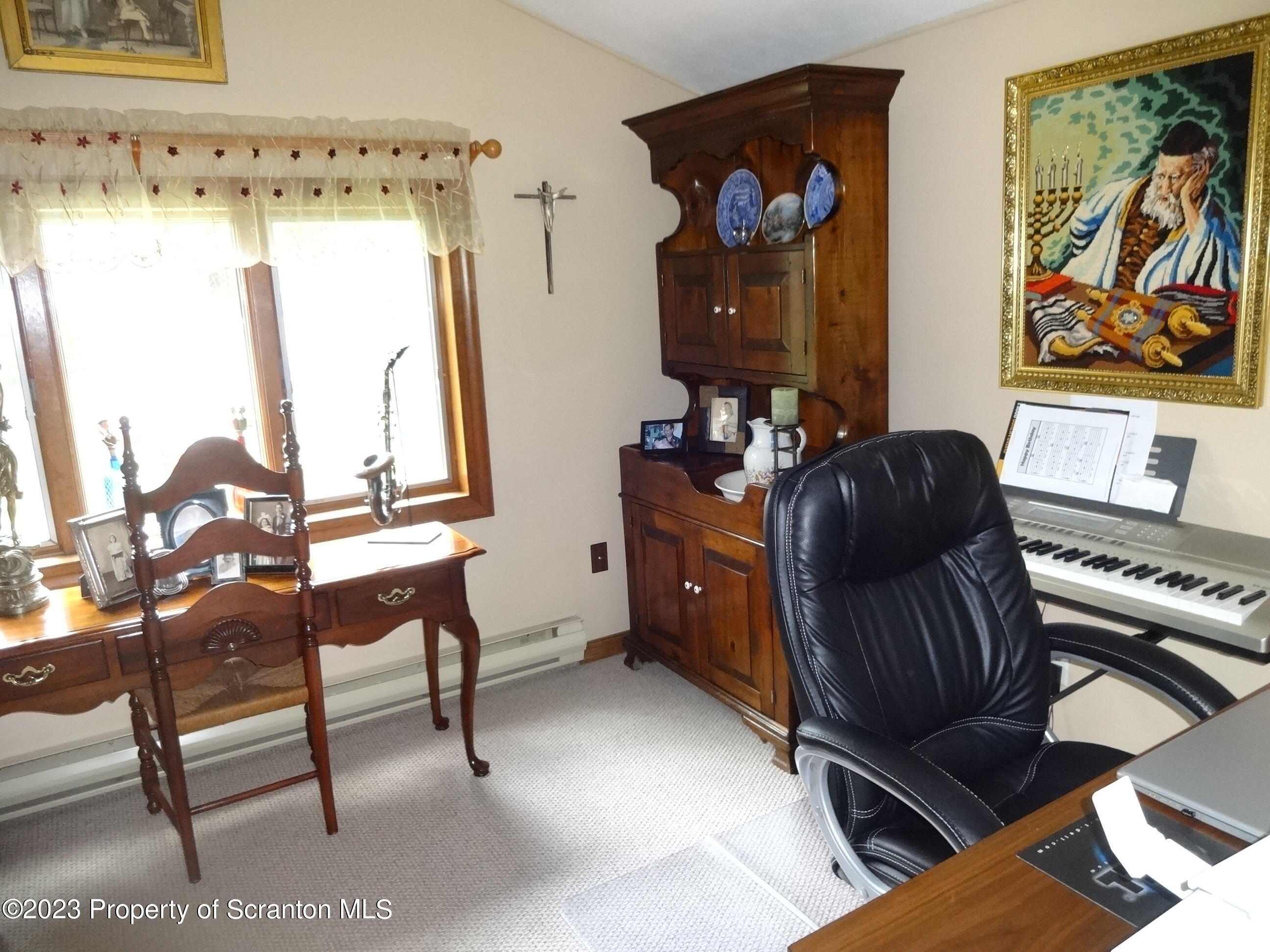 15 Buck River Road Thornhurst, PA 18424 - Photo 19 of 38 a living room with furniture and a window