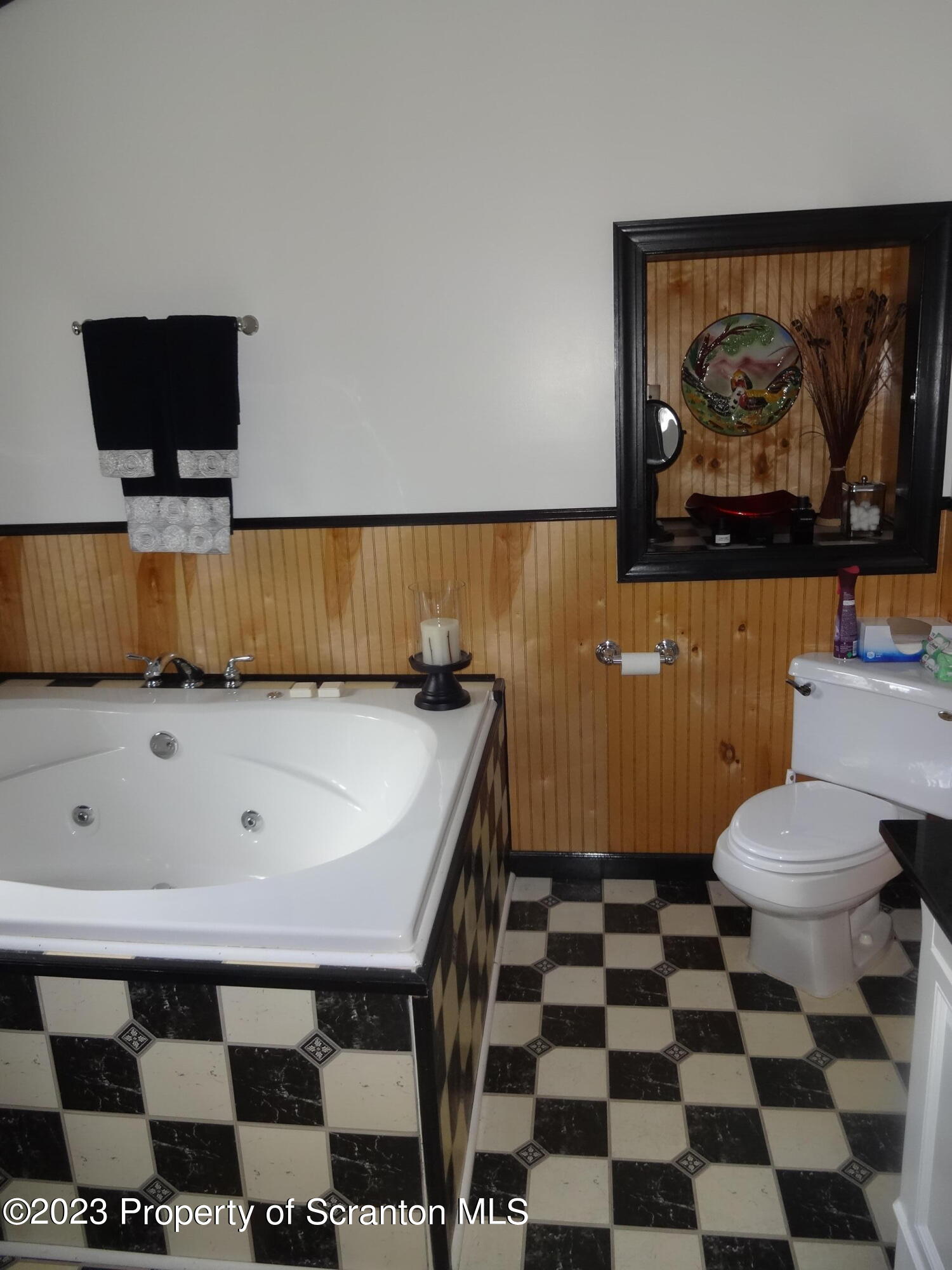15 Buck River Road Thornhurst, PA 18424 - Photo 24 of 38 a living room with a black white checkered floor with a gaming machine and a black white checkered floor