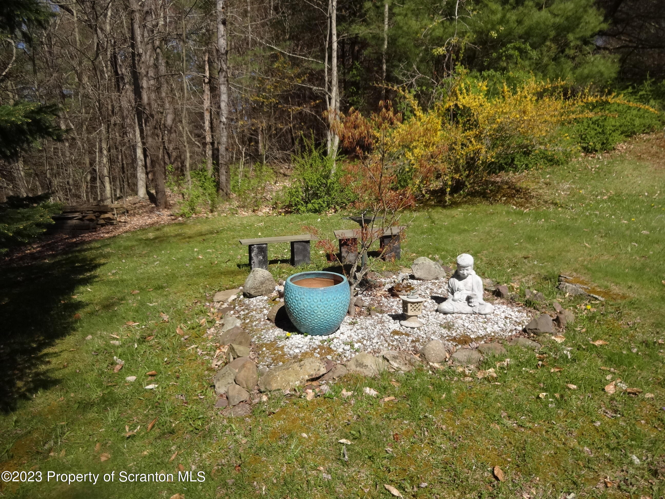 15 Buck River Road Thornhurst, PA 18424 - Photo 30 of 38 a view of a backyard with plants and garden