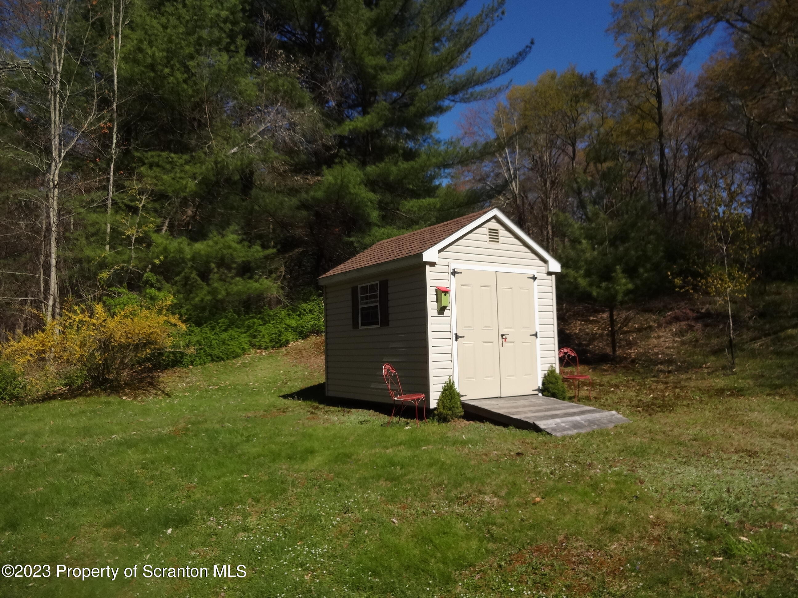 15 Buck River Road Thornhurst, PA 18424 - Photo 31 of 38 a view of a small space with a house and garden