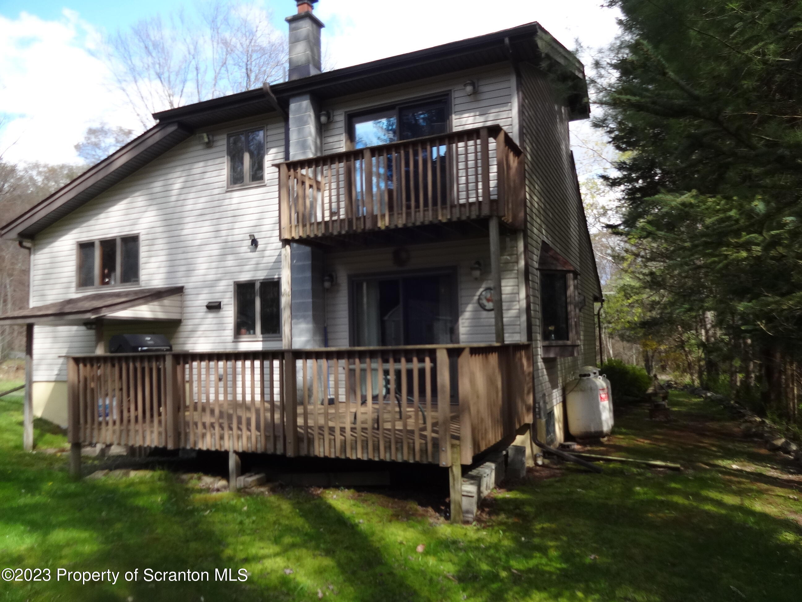 15 Buck River Road Thornhurst, PA 18424 - Photo 35 of 38 a view of a house with a yard and deck