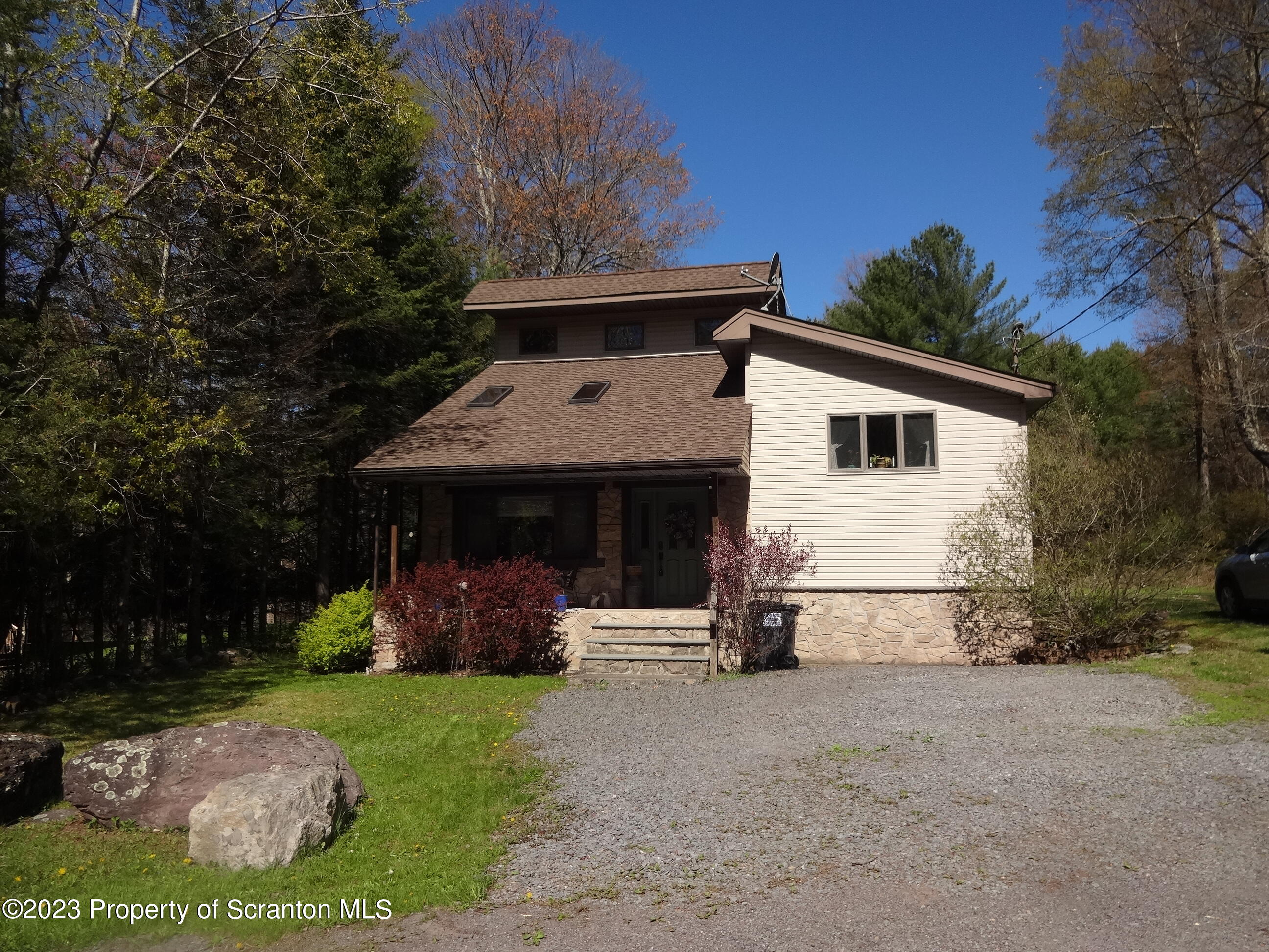 15 Buck River Road Thornhurst, PA 18424 - Photo 37 of 38 a view of a house with backyard and trees