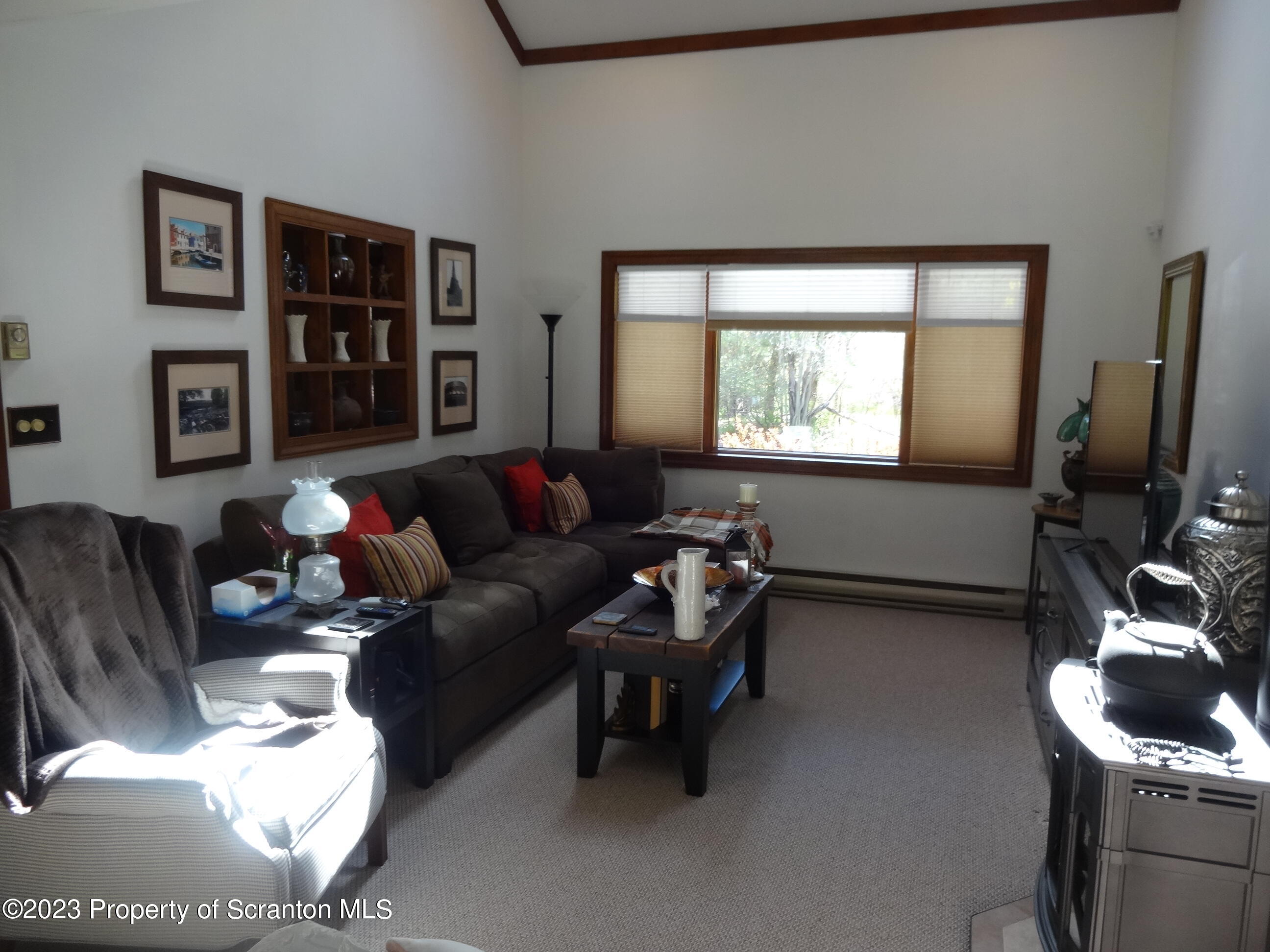 15 Buck River Road Thornhurst, PA 18424 - Photo 4 of 38 a living room with furniture a window and a flat screen tv