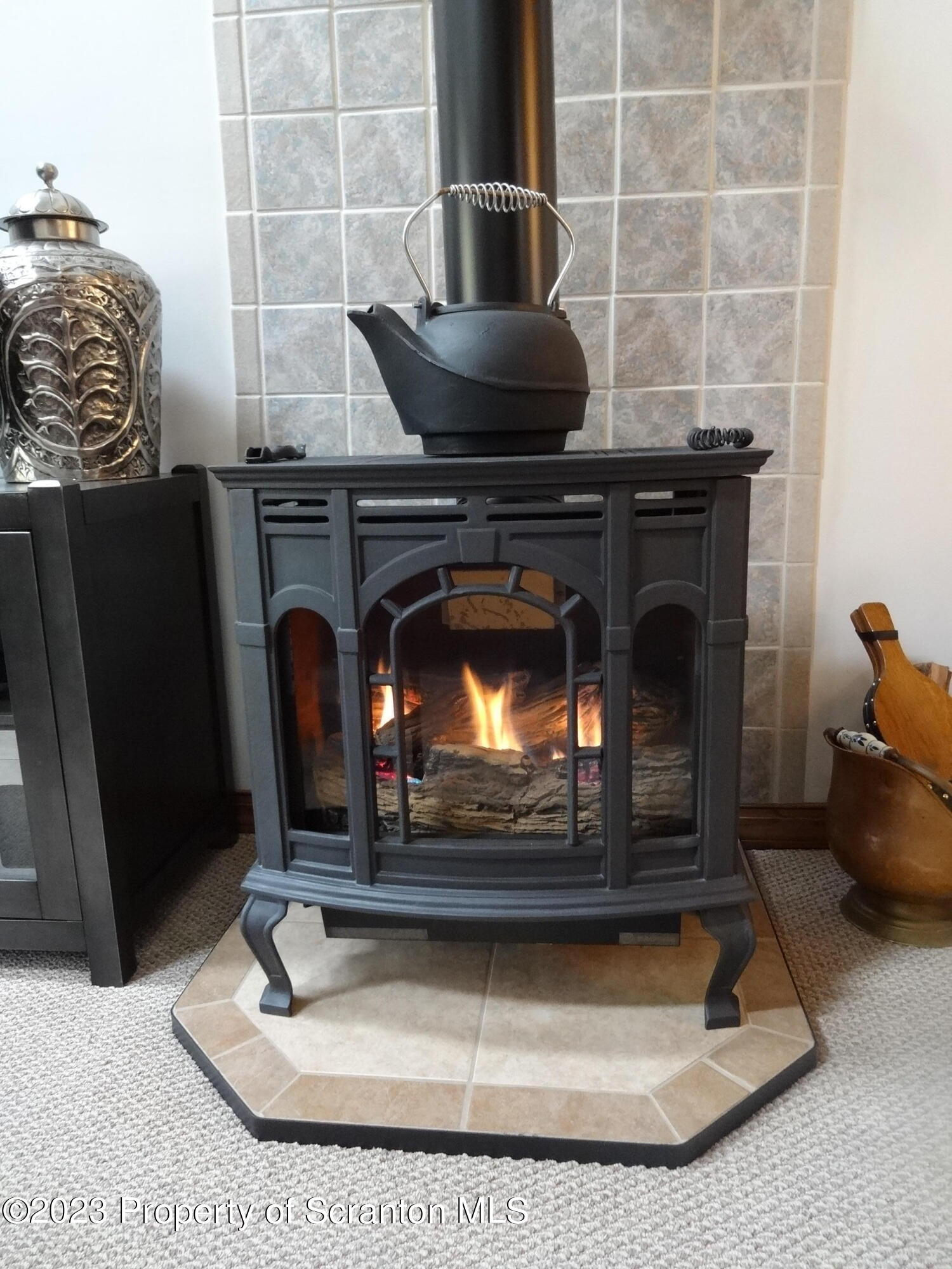 15 Buck River Road Thornhurst, PA 18424 - Photo 5 of 38 a kitchen with a stove and a fireplace