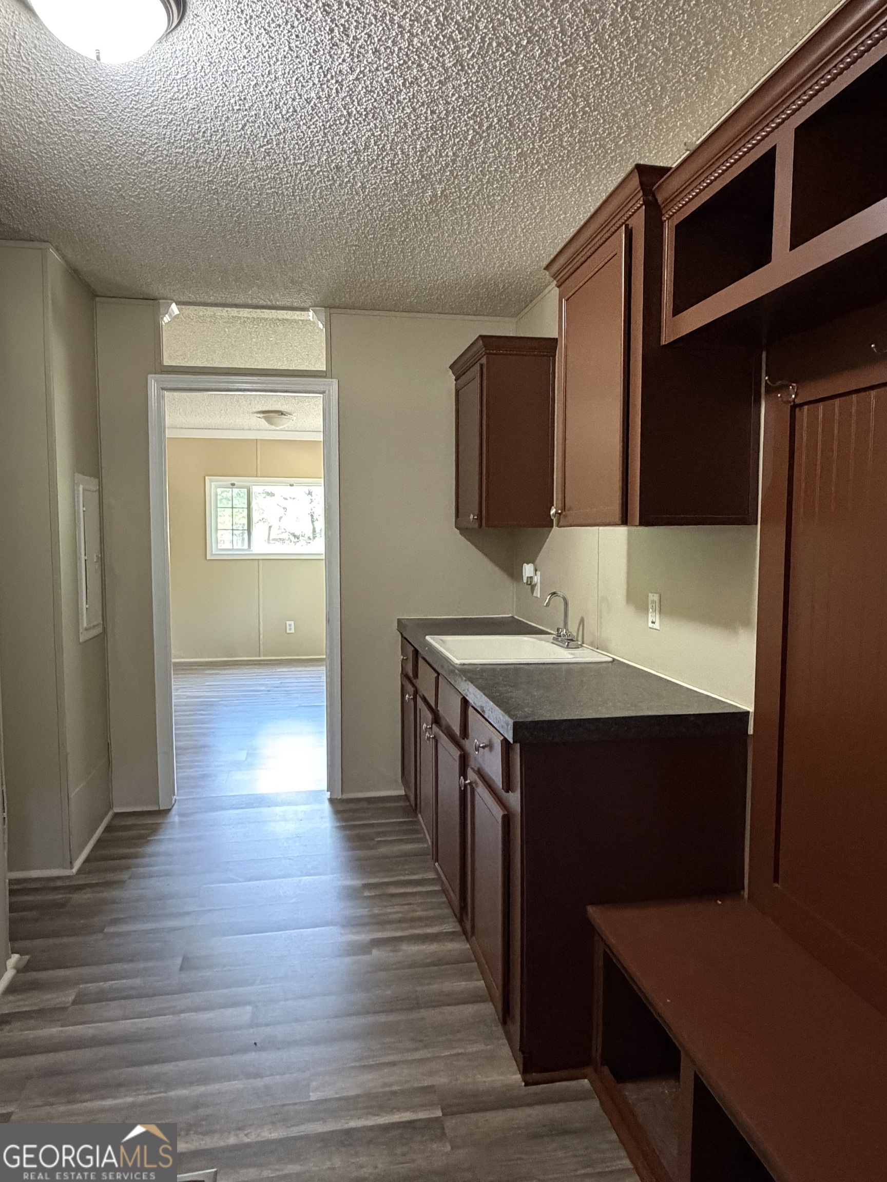 2 Buckboard Trail Jesup, GA 31546 - Photo 11 of 39 a kitchen with a sink and a refrigerator