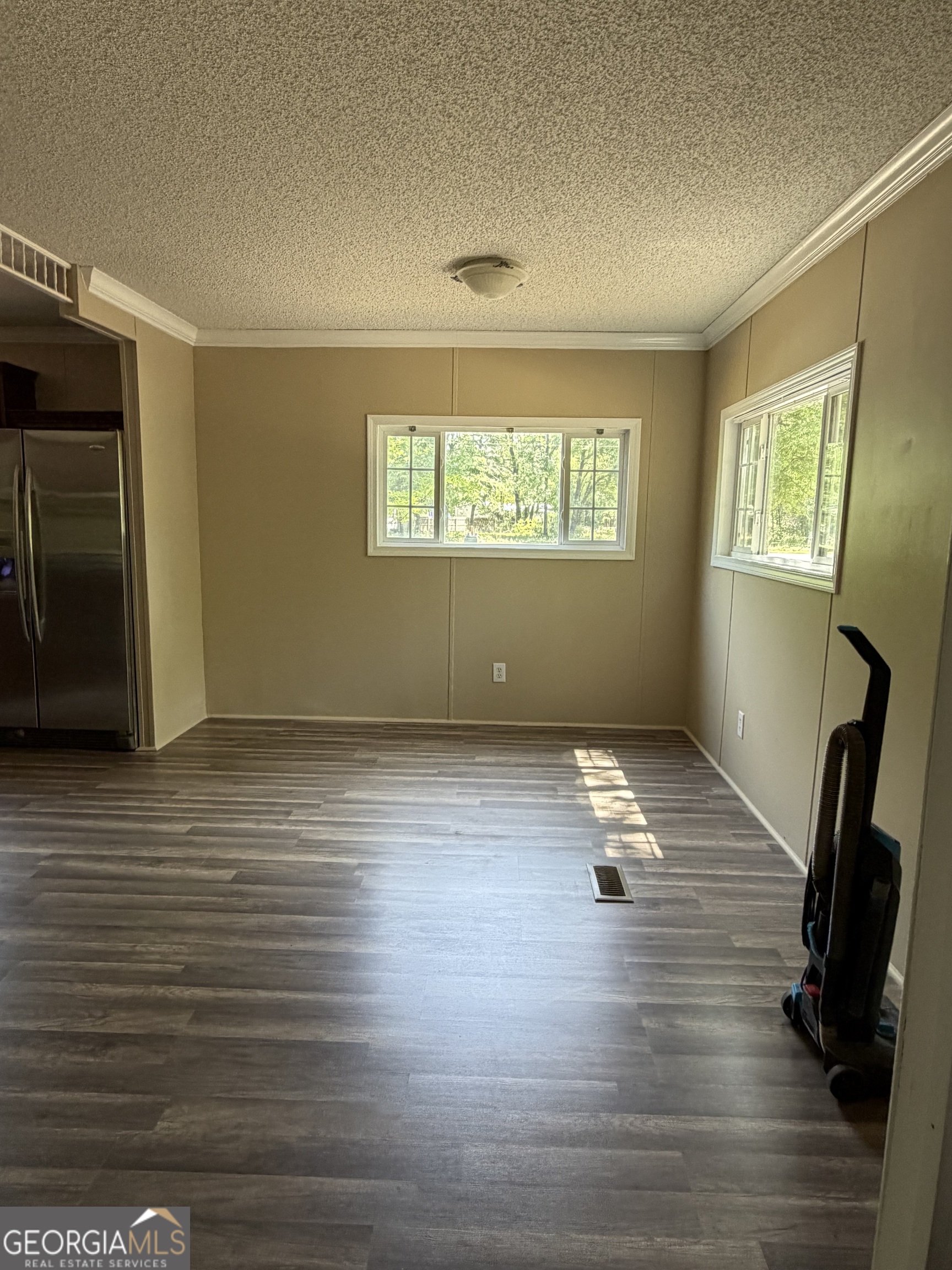 2 Buckboard Trail Jesup, GA 31546 - Photo 13 of 39 a room with wooden floor and windows