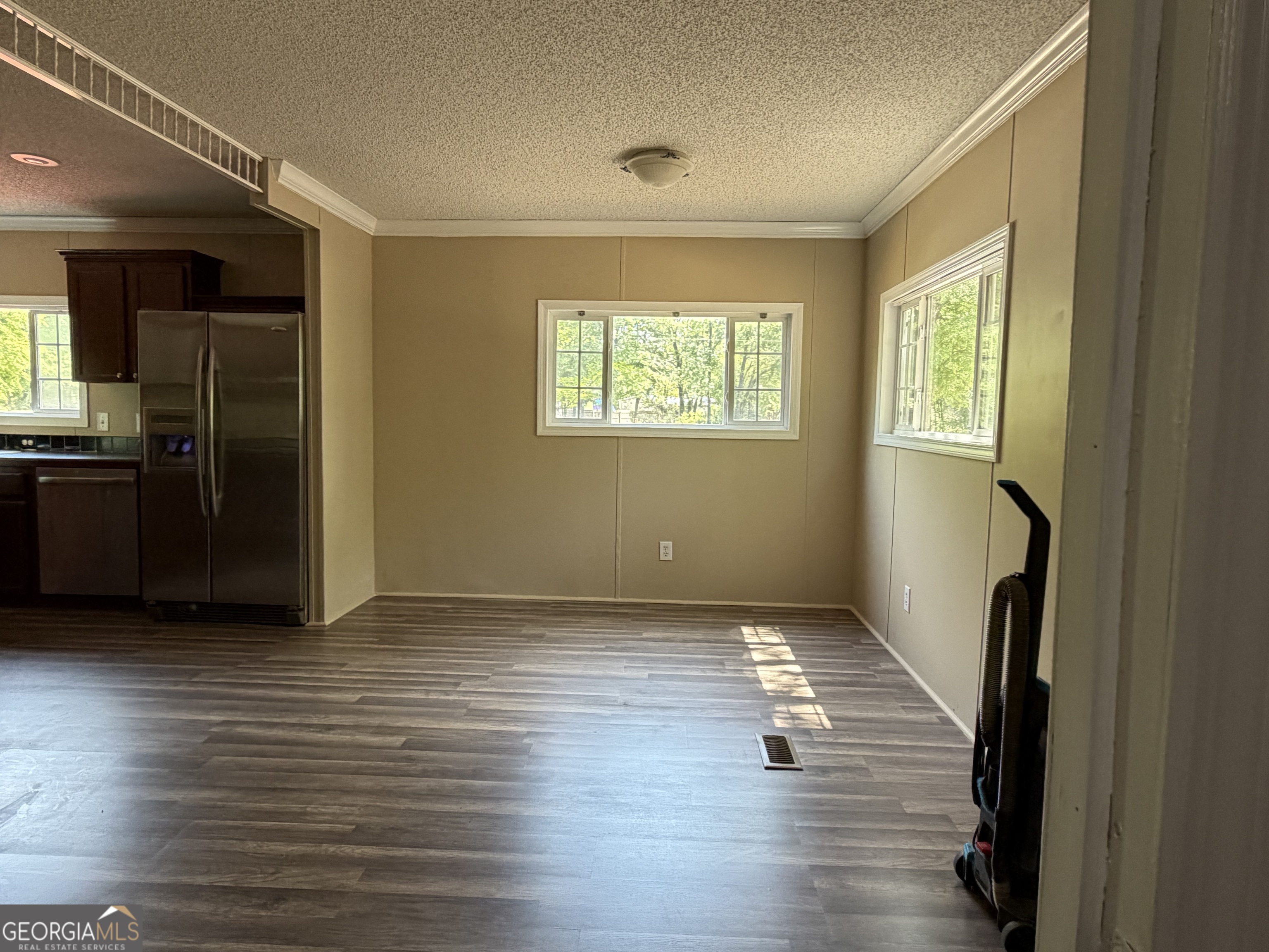 2 Buckboard Trail Jesup, GA 31546 - Photo 14 of 39 an empty room with wooden floor and windows