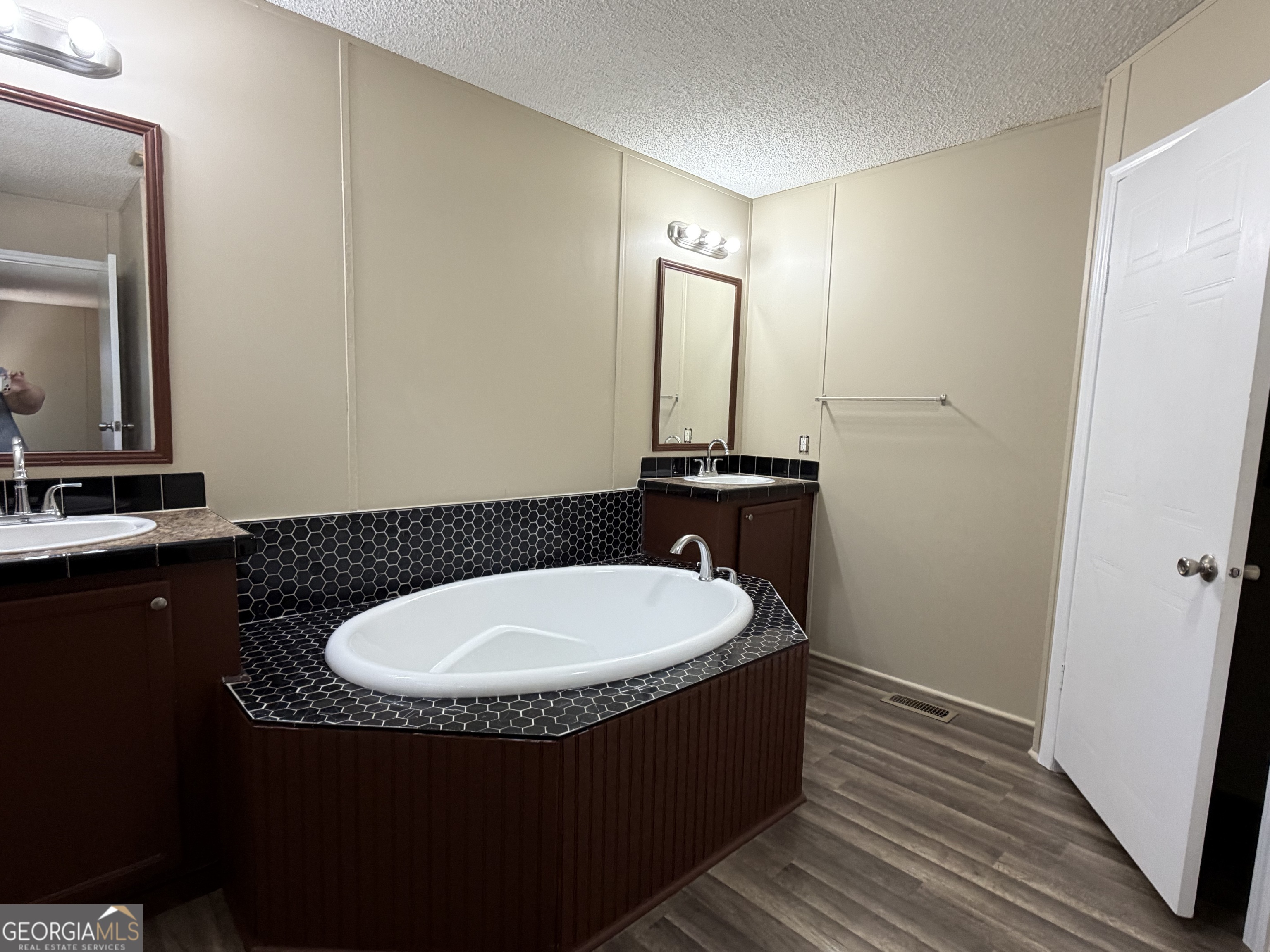 2 Buckboard Trail Jesup, GA 31546 - Photo 18 of 39 a bathroom with a sink and a mirror