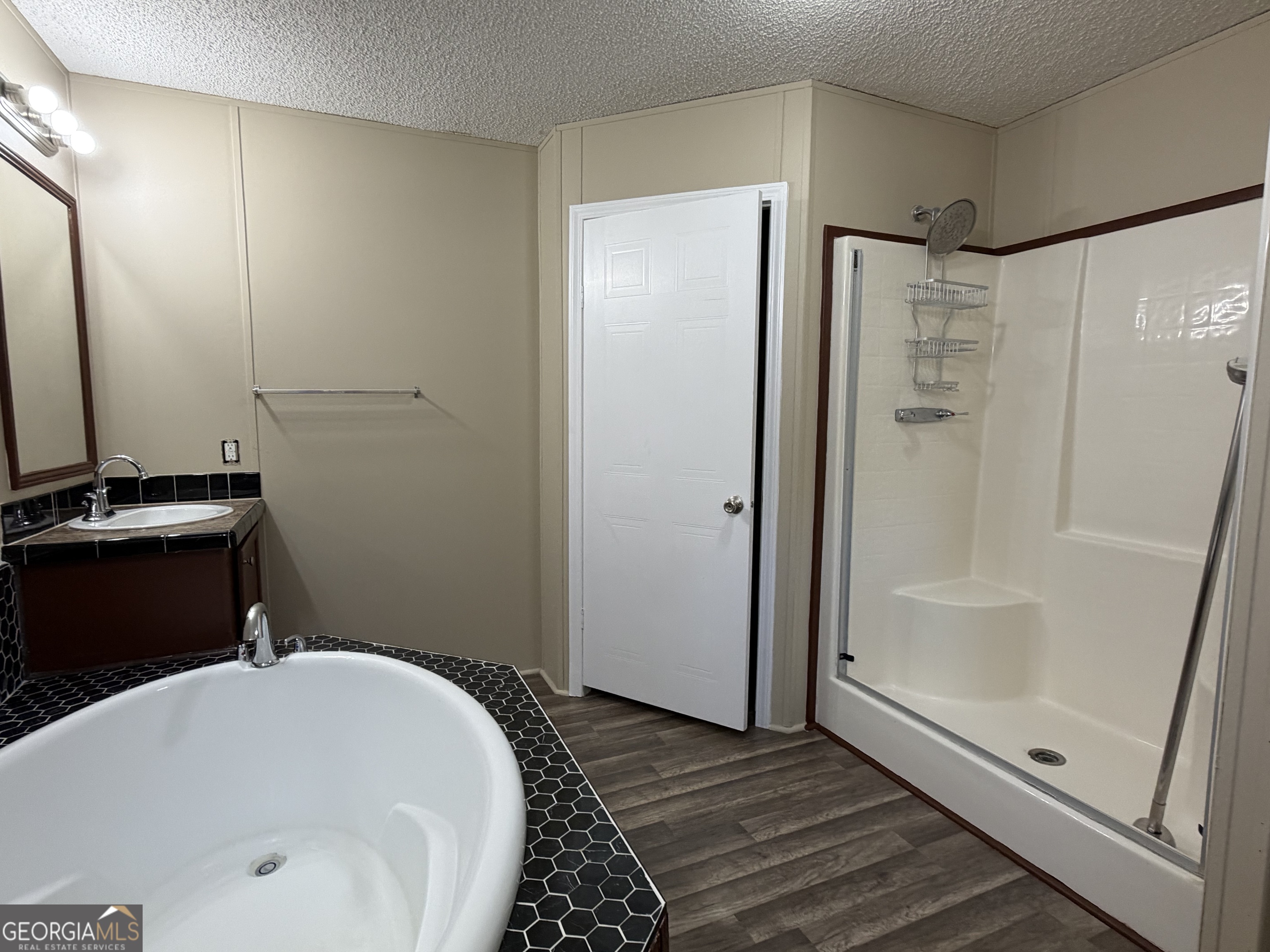 2 Buckboard Trail Jesup, GA 31546 - Photo 19 of 39 a bathroom with a bathtub and a shower