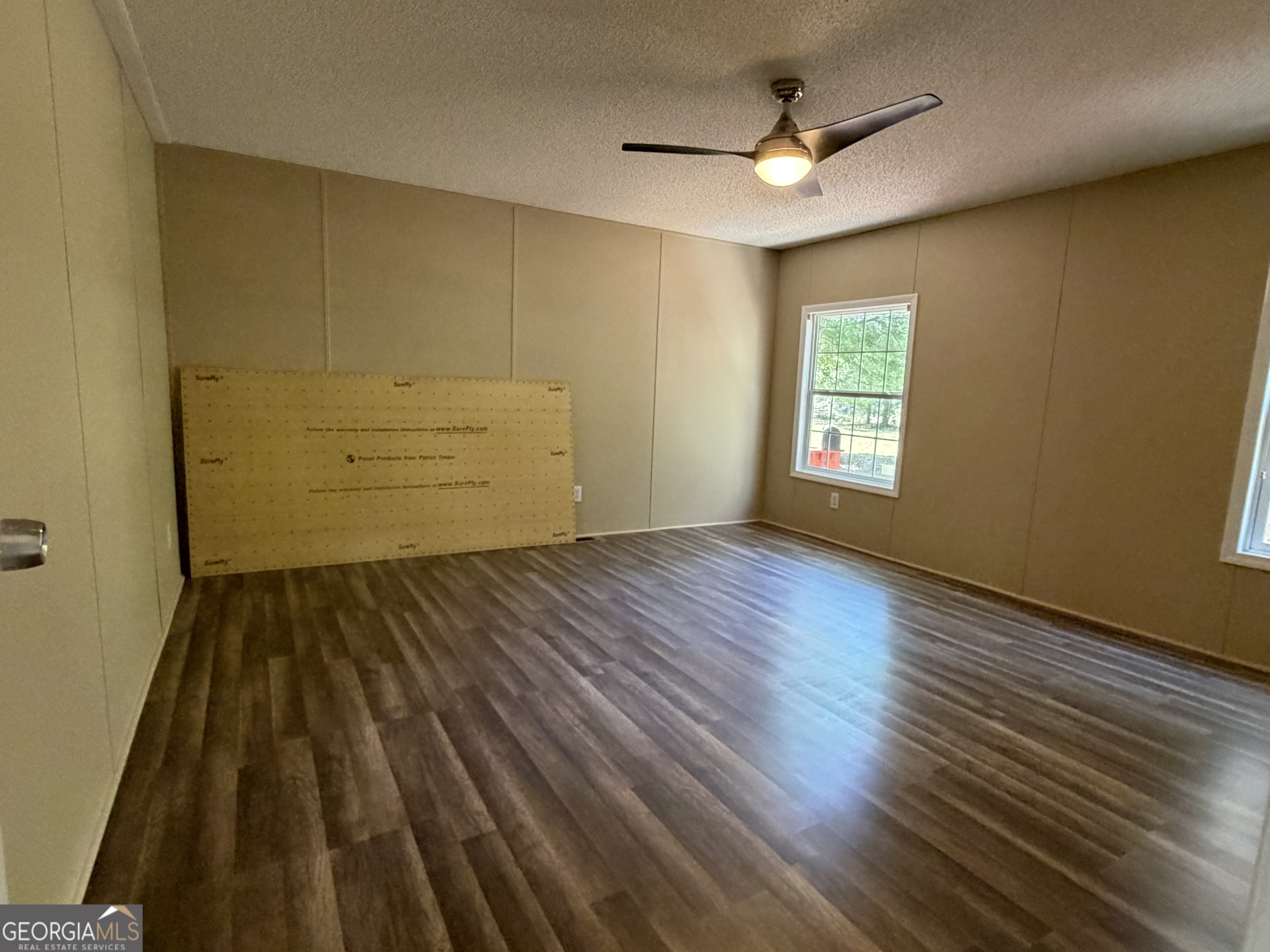 2 Buckboard Trail Jesup, GA 31546 - Photo 23 of 39 a view of a room with wooden floor and ceiling fan