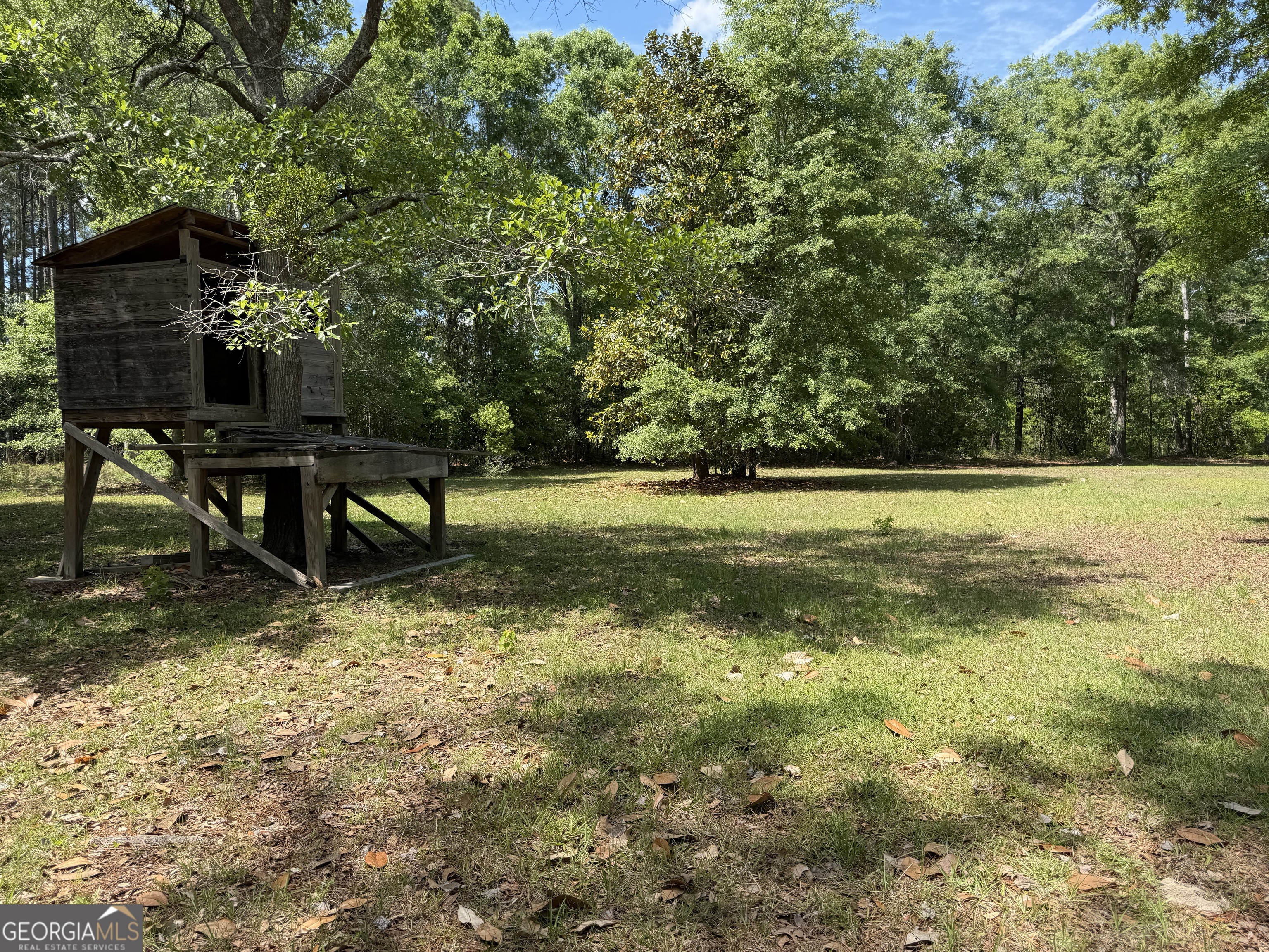 2 Buckboard Trail Jesup, GA 31546 - Photo 30 of 39 a view of a green field with wooden fence