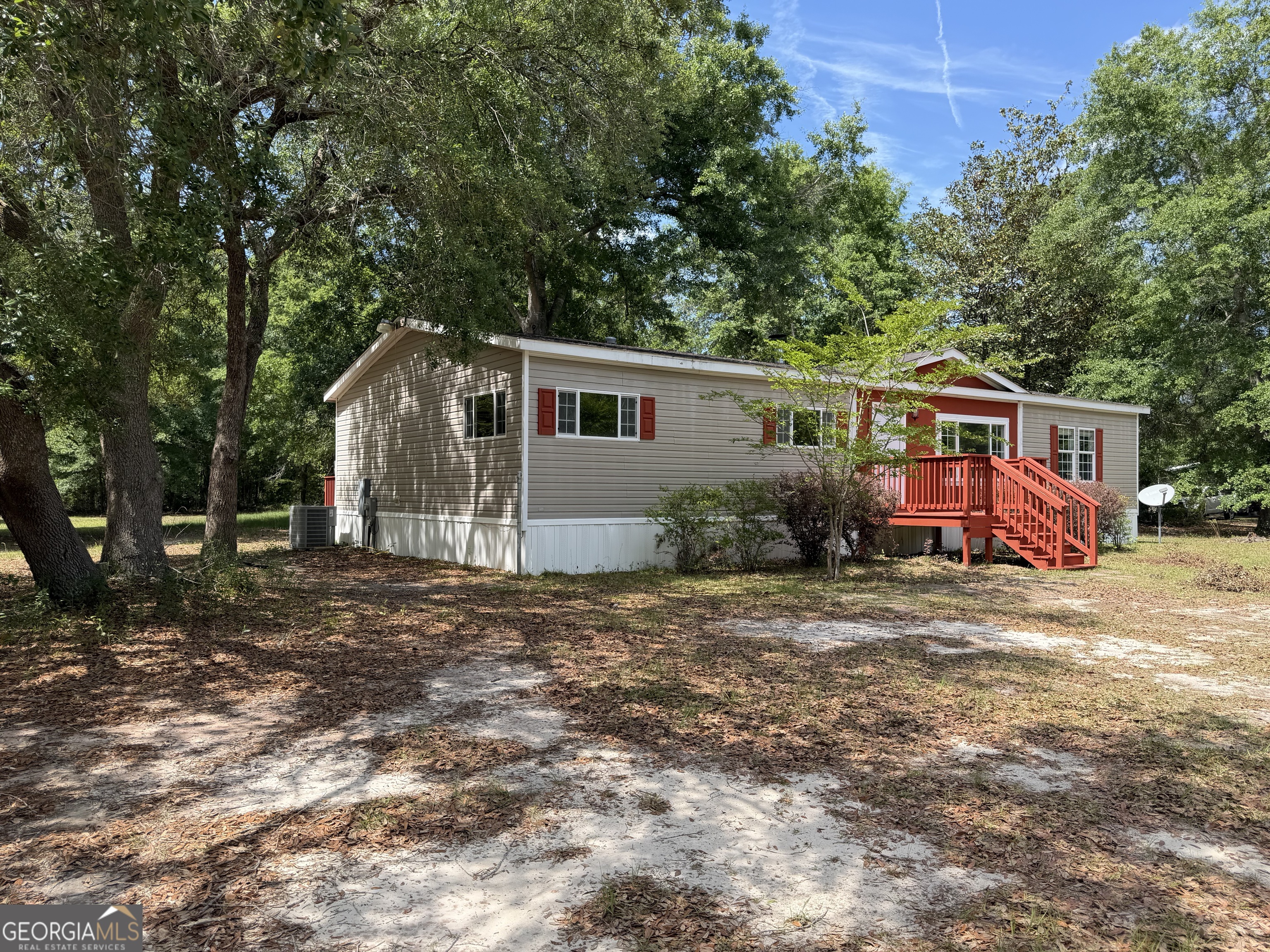 2 Buckboard Trail Jesup, GA 31546 - Photo 3 of 39 a front view of a house with garden