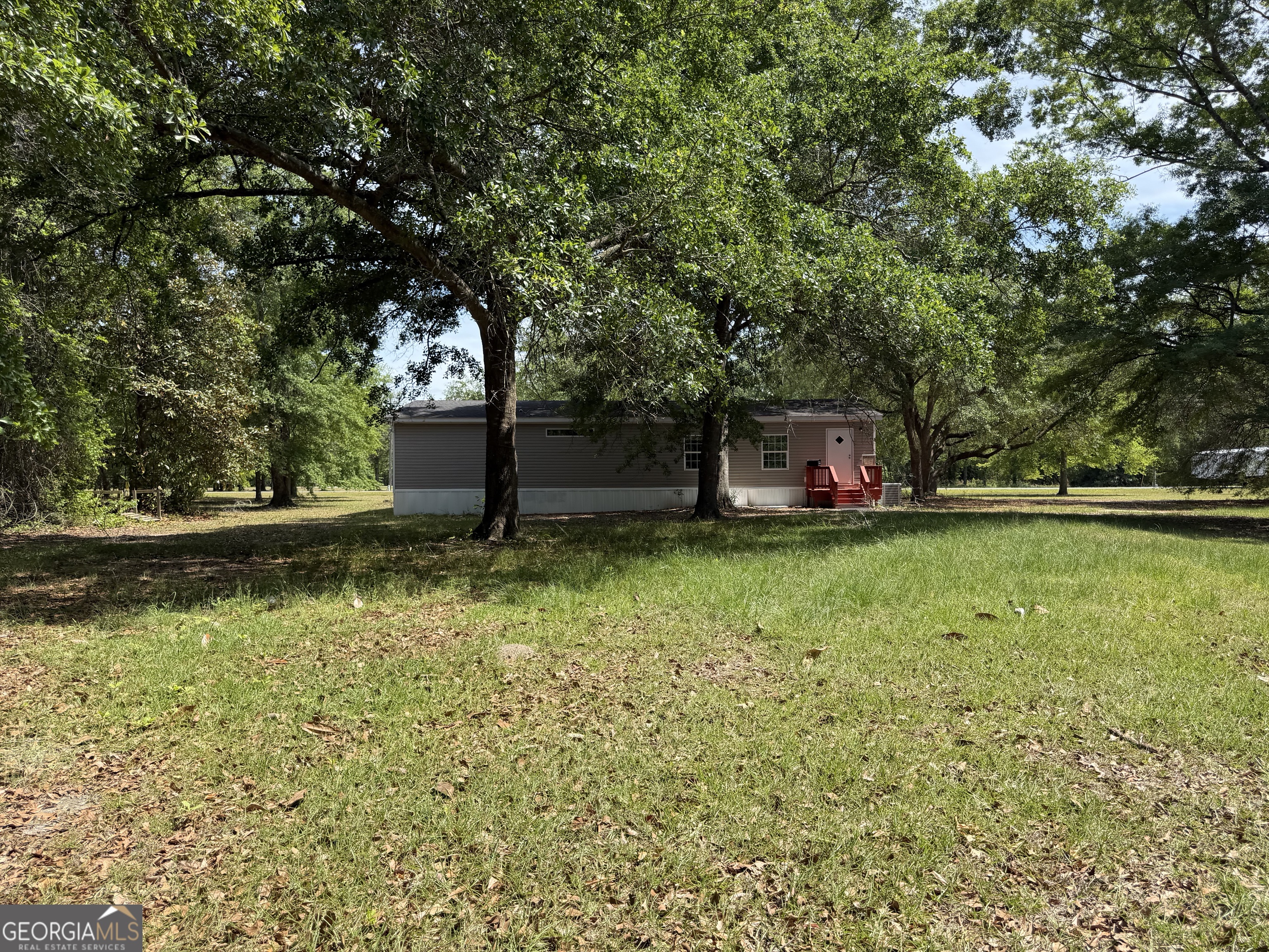 2 Buckboard Trail Jesup, GA 31546 - Photo 33 of 39 a view of a house with a yard