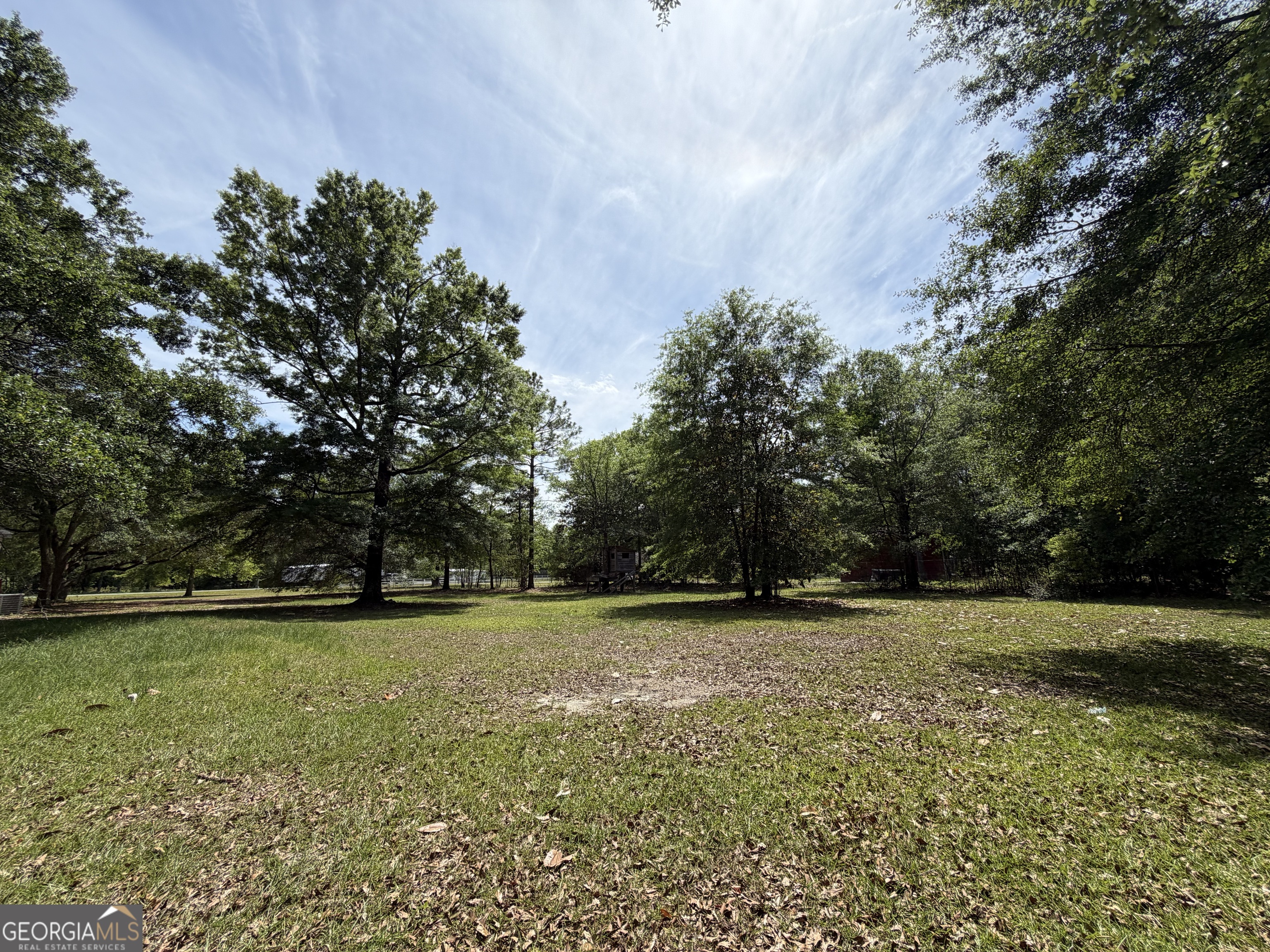 2 Buckboard Trail Jesup, GA 31546 - Photo 37 of 39 a view of a field with trees in the background