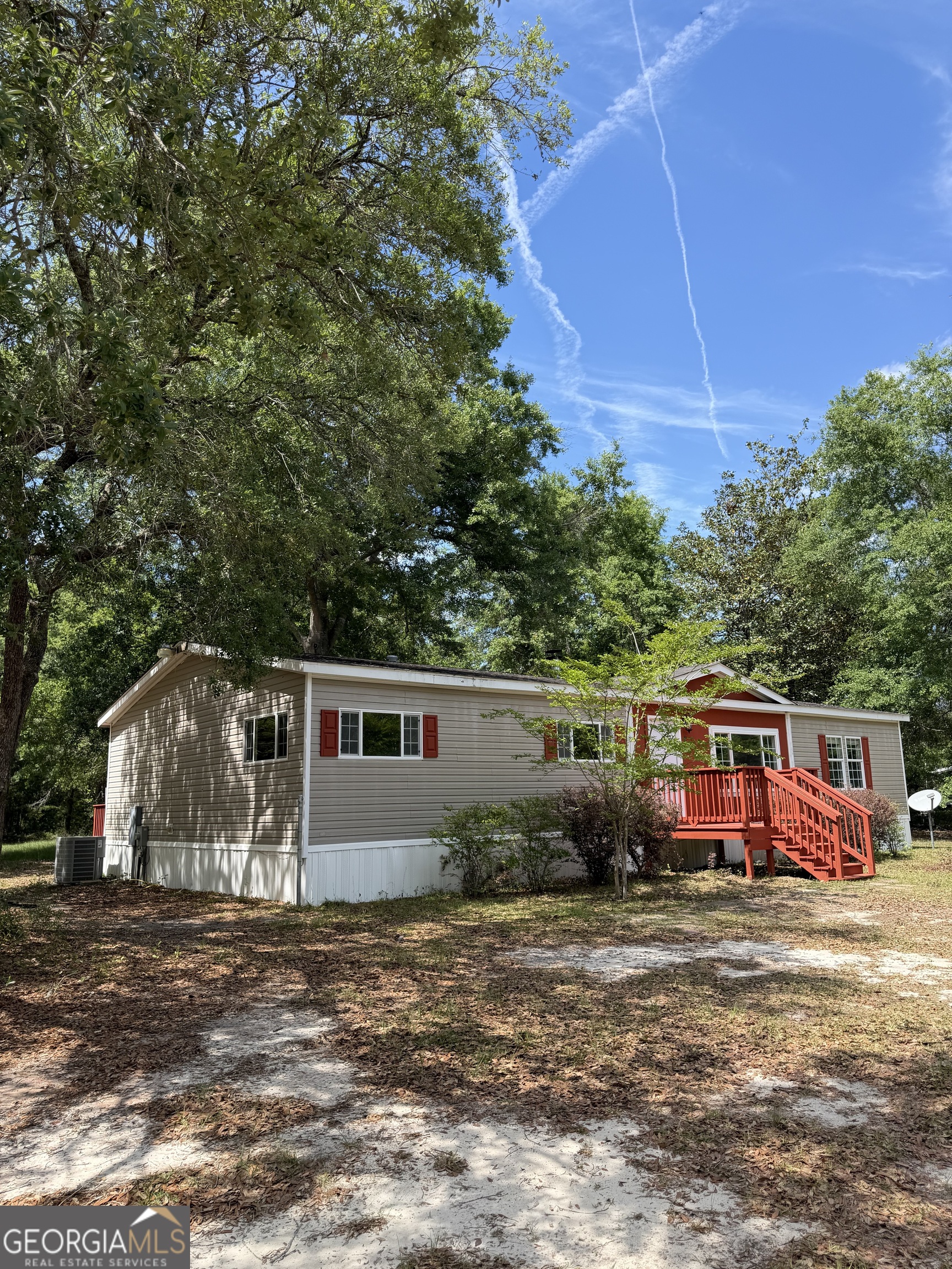 2 Buckboard Trail Jesup, GA 31546 - Photo 5 of 39 a front view of a house with a yard