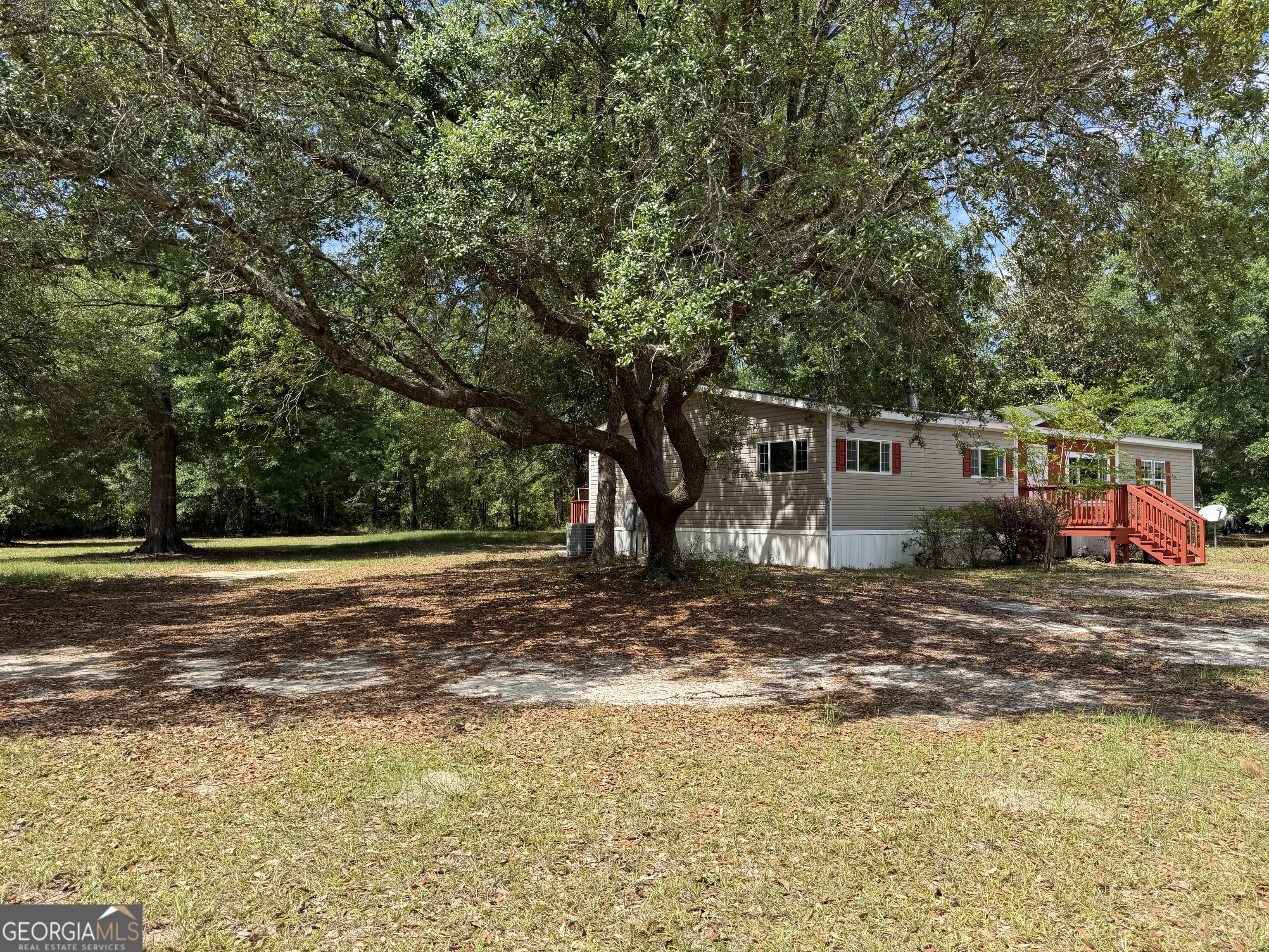 2 Buckboard Trail Jesup, GA 31546 - Photo 6 of 39 a view of a outdoor space with trees