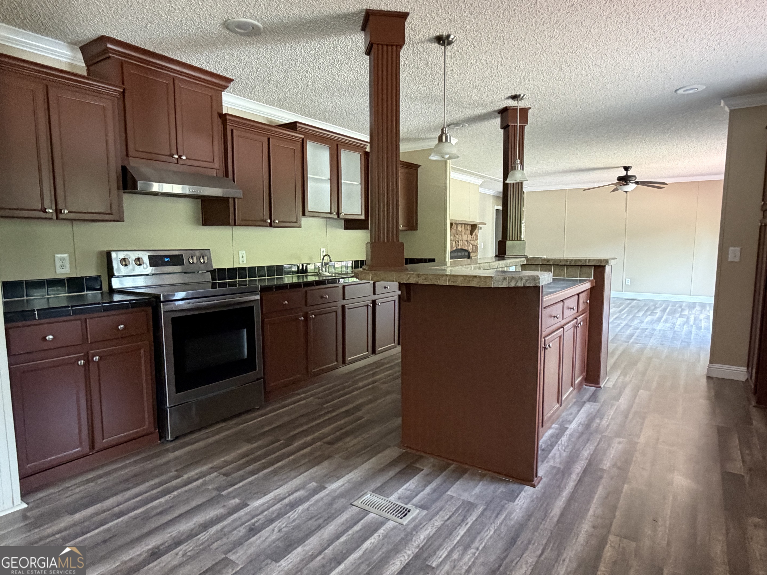 2 Buckboard Trail Jesup, GA 31546 - Photo 9 of 39 a kitchen with stainless steel appliances granite countertop a stove a sink and a refrigerator