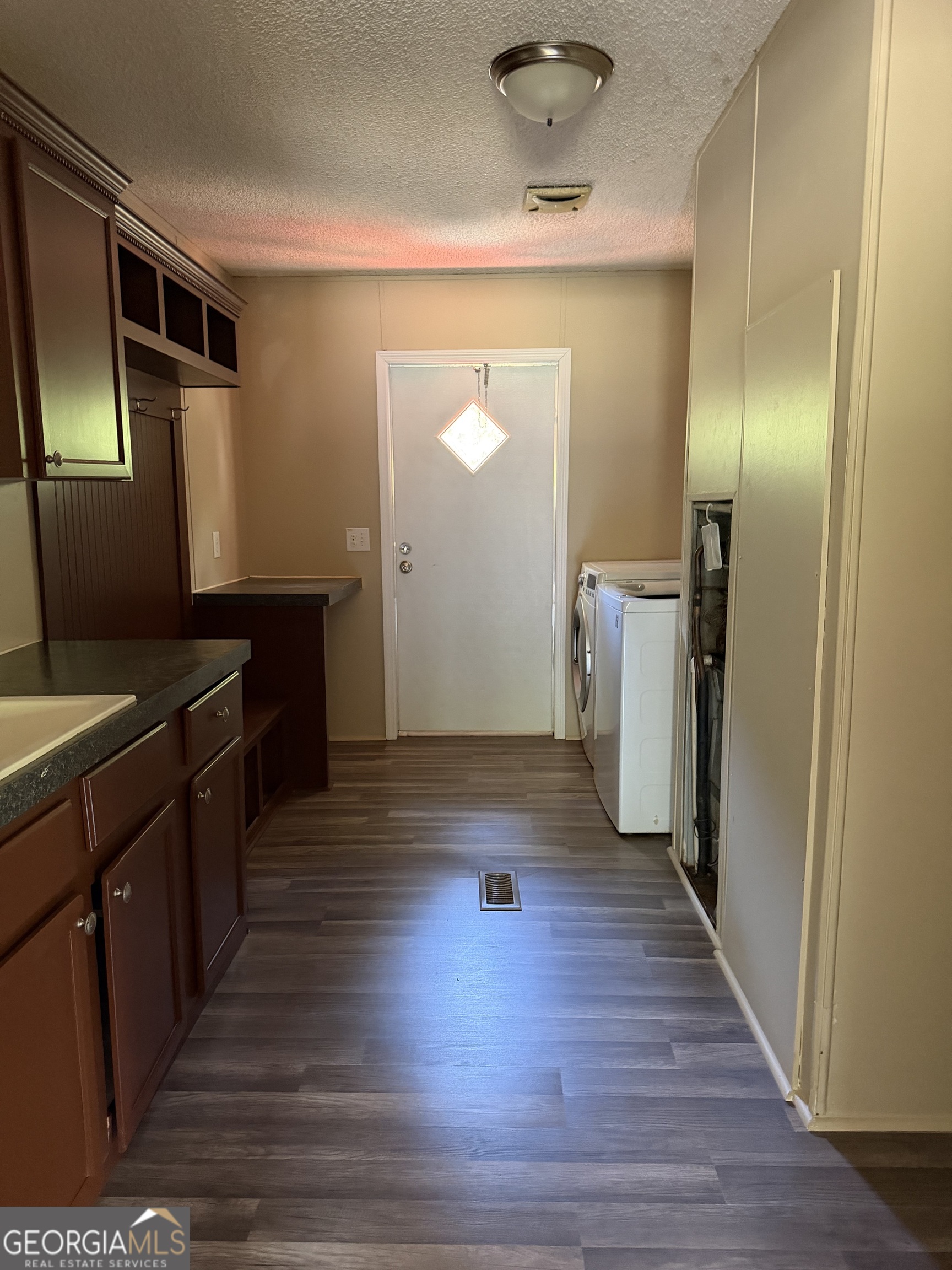 2 Buckboard Trail Jesup, GA 31546 - Photo 10 of 39 a kitchen with a refrigerator and a sink