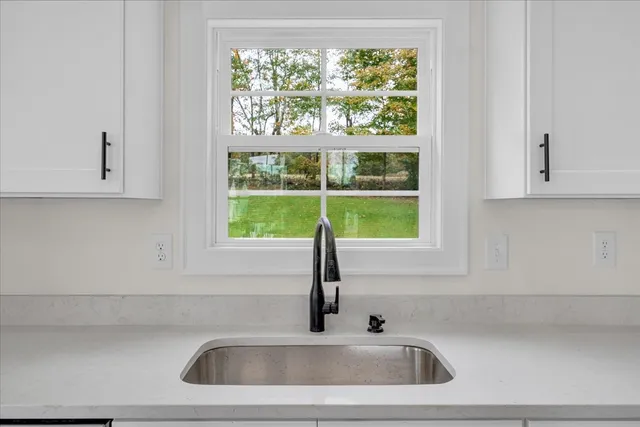 a kitchen sink with a window
