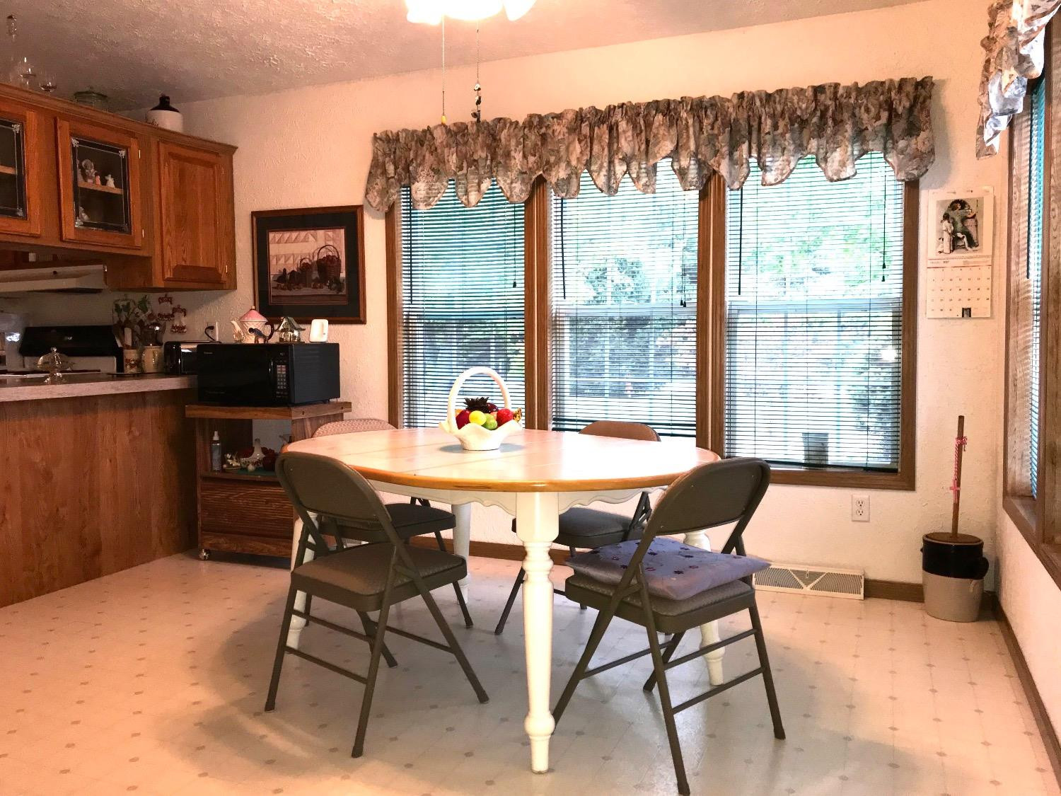 2521 South Range Road Knox, IN 46534 - Photo 8 of 17 a view of a dining room with furniture window and outside view