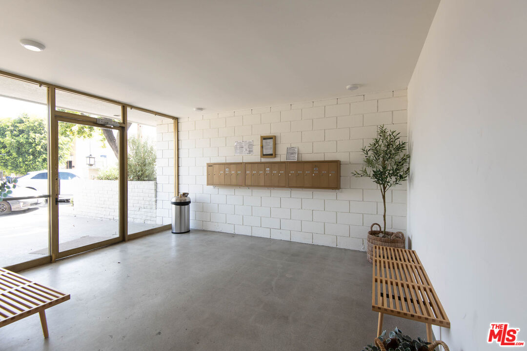 5935 Chula Vista Way, Unit 103 Los Angeles, CA 90068 - Photo 12 of 12 a view of livingroom with furniture and floor to ceiling window