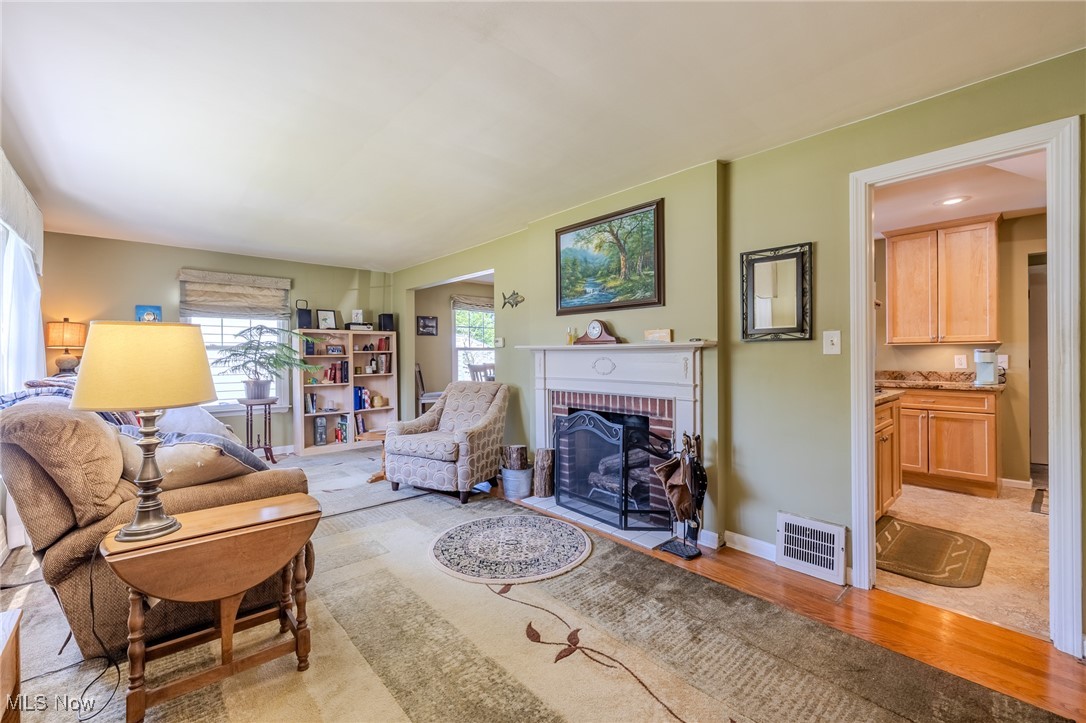 4959 Anderson Road Cleveland, OH 44124 - Photo 32 of 43 Living room featuring a fireplace and light wood-style floors