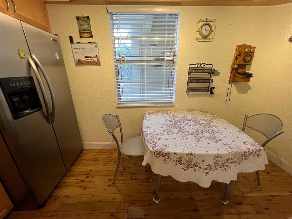 3910 Inverrary Boulevard, Unit 301B Lauderhill, FL 33319 - Photo 11 of 44 a view of a livingroom with wooden floor and furniture