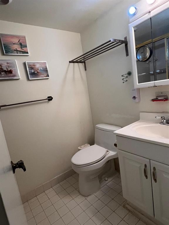 3910 Inverrary Boulevard, Unit 301B Lauderhill, FL 33319 - Photo 19 of 44 a bathroom with a sink toilet and shower
