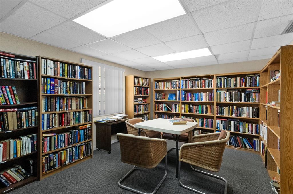3910 Inverrary Boulevard, Unit 301B Lauderhill, FL 33319 - Photo 41 of 44 a view of a work space with furniture and book shelf