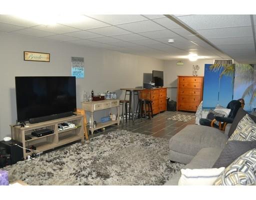 21 Middle Road Amesbury, MA 01913 - Photo 7 of 21 a living room with furniture and a flat screen tv