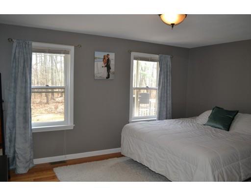 21 Middle Road Amesbury, MA 01913 - Photo 9 of 21 a bedroom with a bed and window