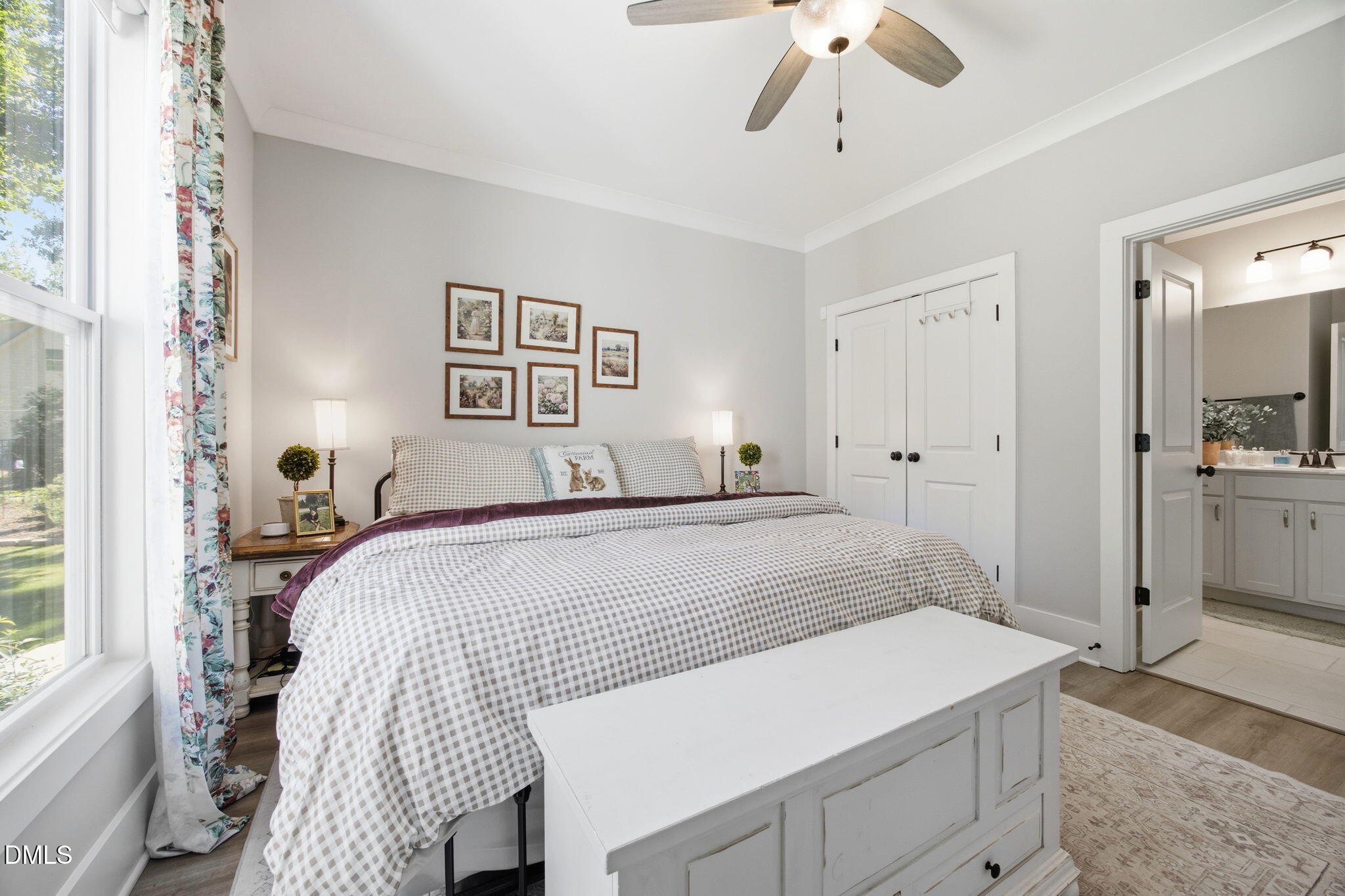 3511 Bruce Garner Road Wake Forest, NC 27587 - Photo 26 of 56 a bedroom with a bed and a chandelier