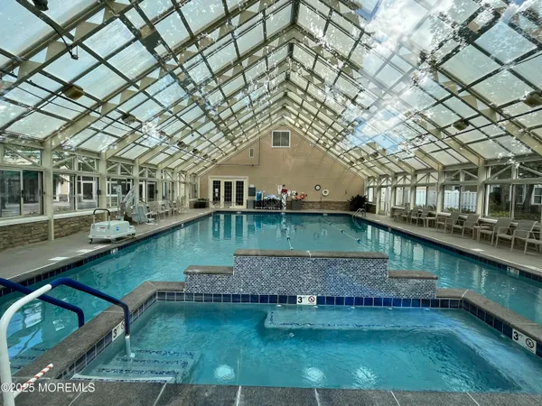 a view of a patio with swimming pool