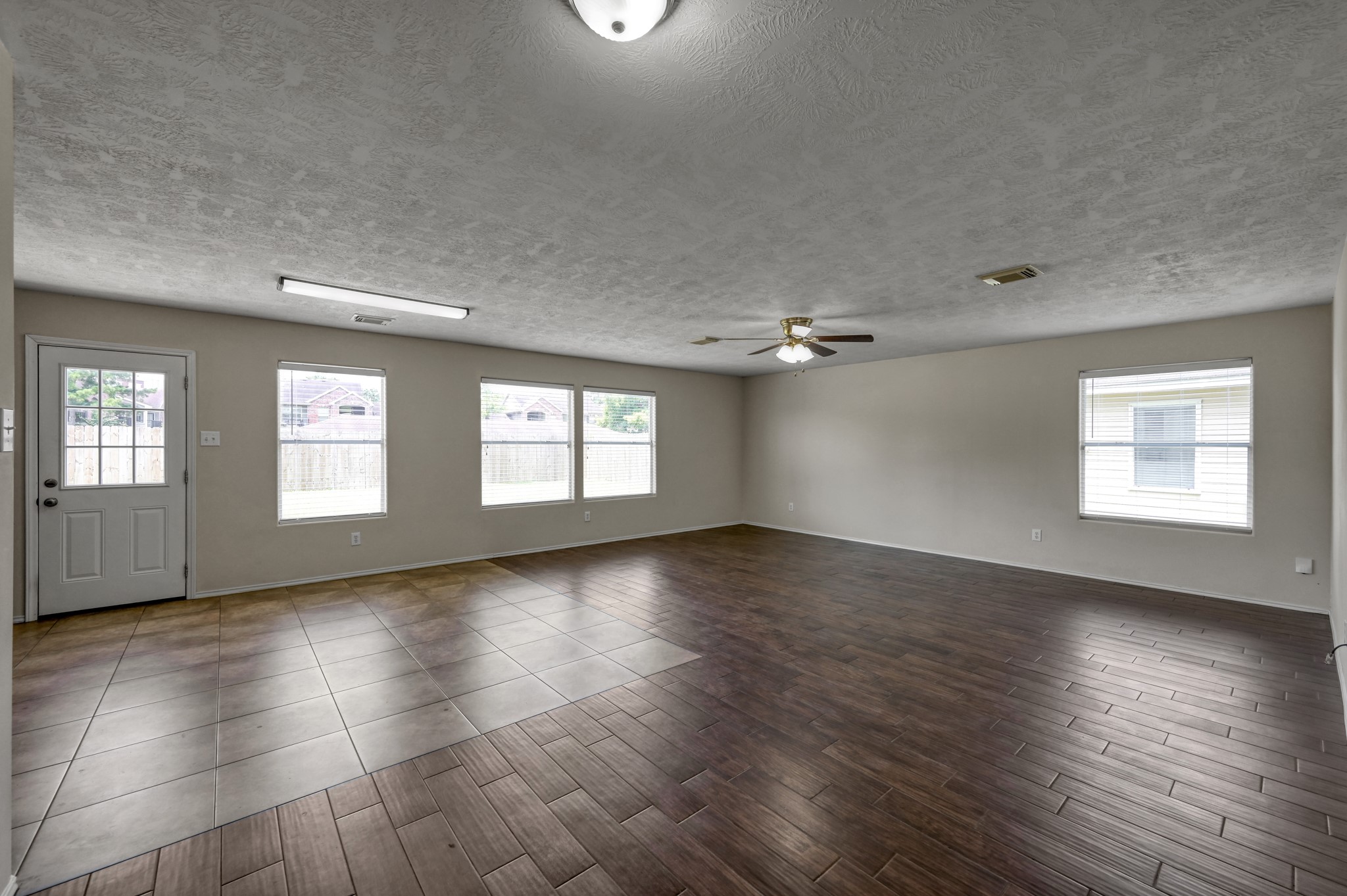 23919 Kingbriar Drive Spring, TX 77373 - Photo 9 of 33 The spacious living room offers plenty of room to relax or entertain with abundant natural light.
