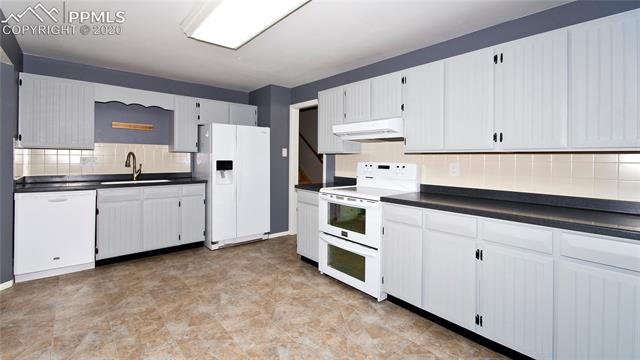 4027 Maxwell Road Colorado Springs, CO 80909 - Photo 11 of 35 Kitchen with updated cabinets