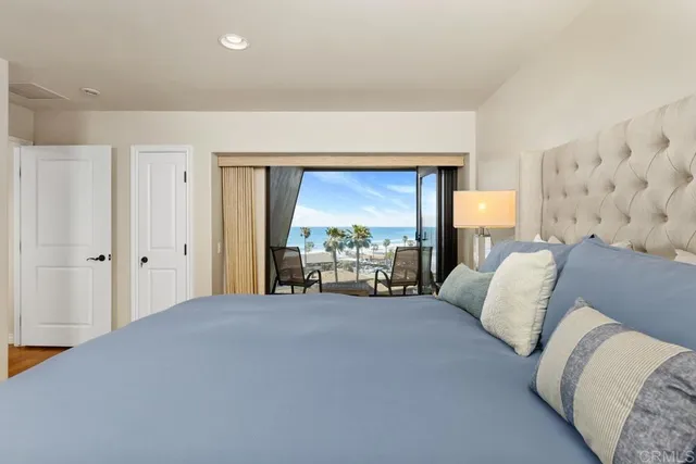 a bed room with a bed and a large window