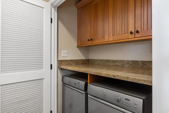 a kitchen with granite countertop cabinets and stove
