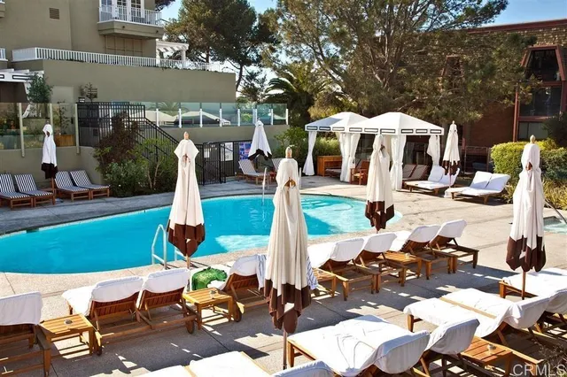 a front view of a house with garden view