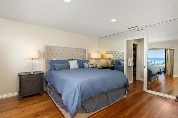 a bedroom with bed and window