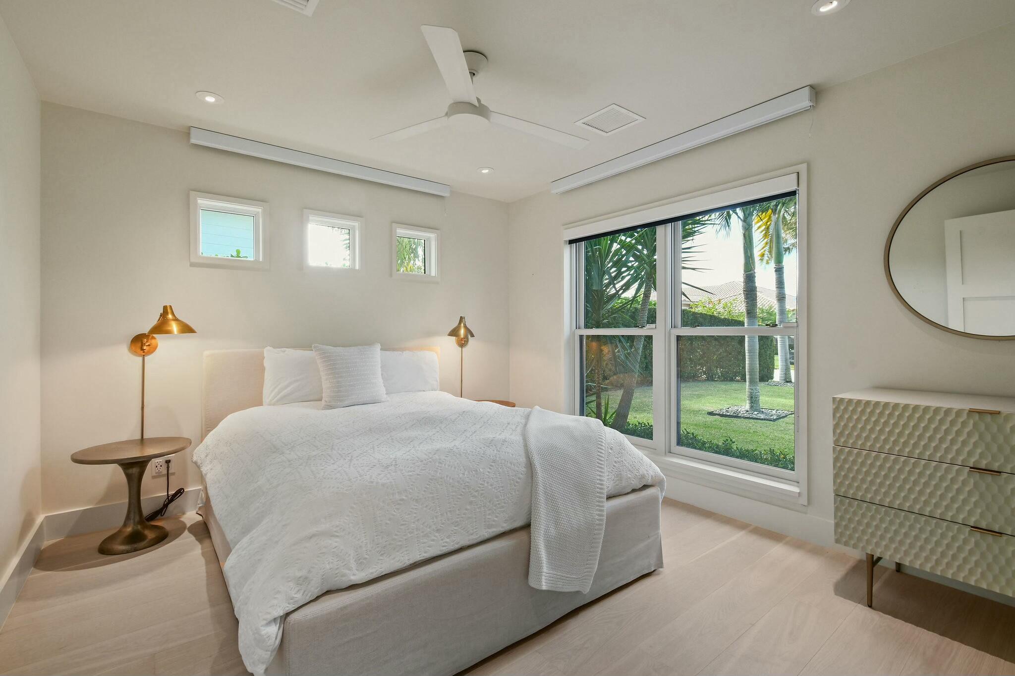 170 Beacon Lane Jupiter Inlet Colony, FL 33469 - Photo 19 of 46 a bedroom with a bed and a window