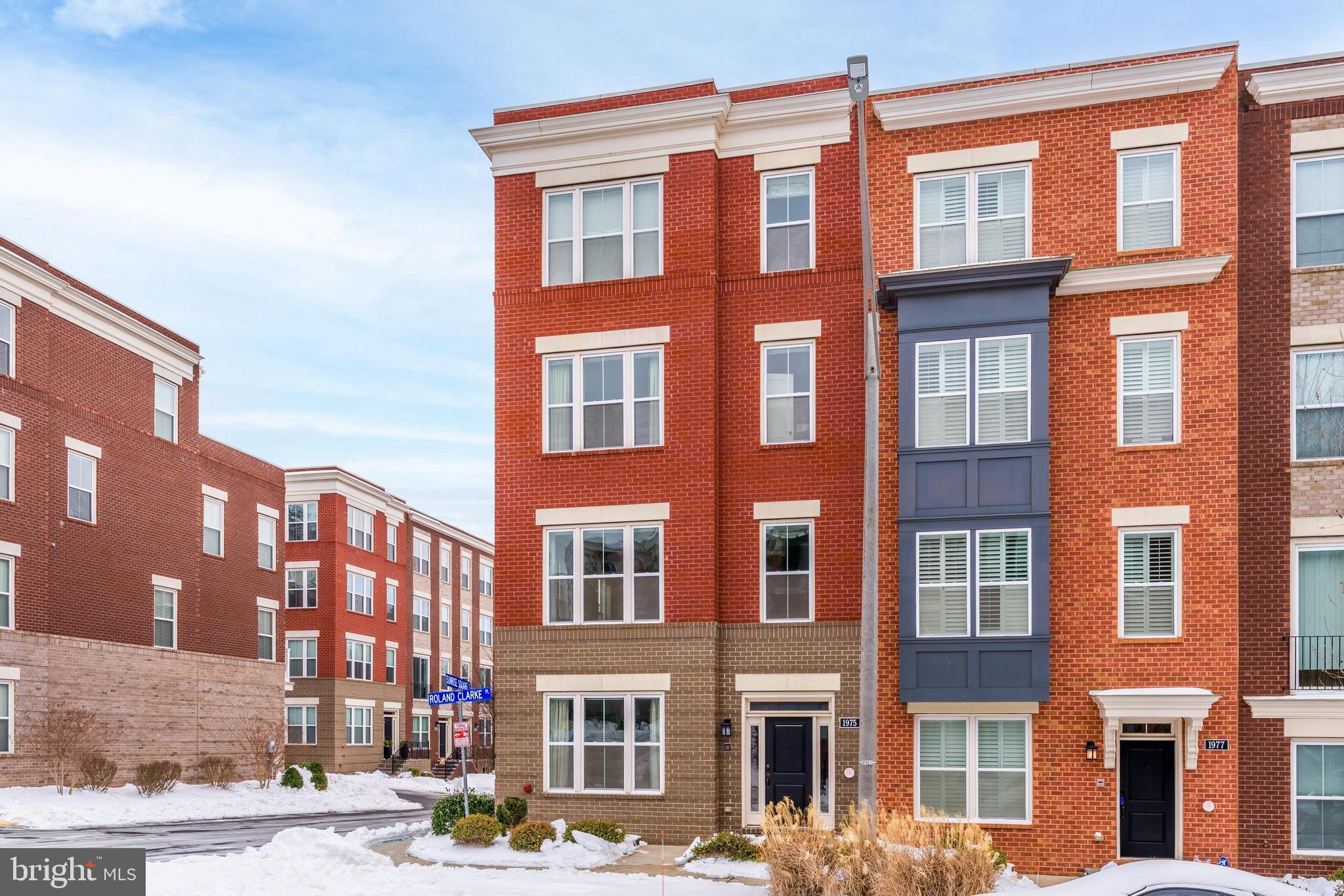 1975 Roland Clarke Place Reston, VA 20191 - Photo 3 of 10 a front view of a multi story building