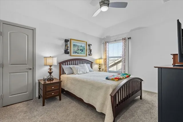 a bedroom with a bed and a table in it