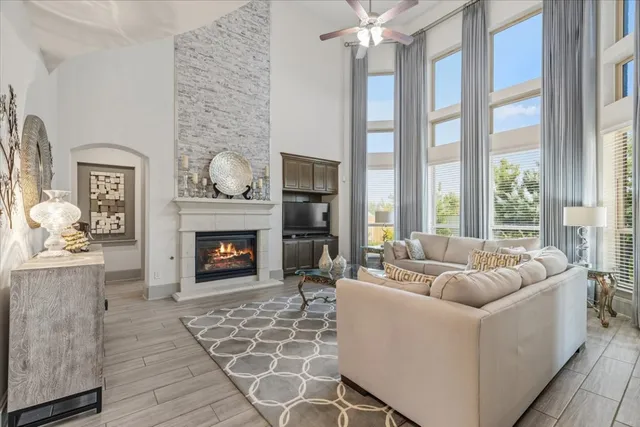 a living room with furniture and a fireplace