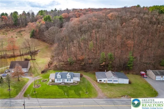a view of a swimming pool with a yard