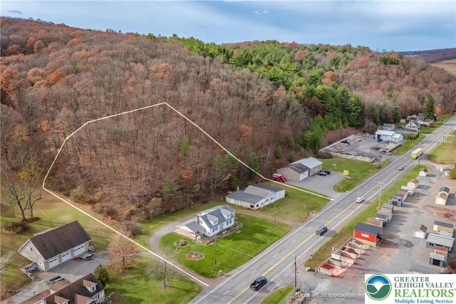 a view of a small pool with a yard